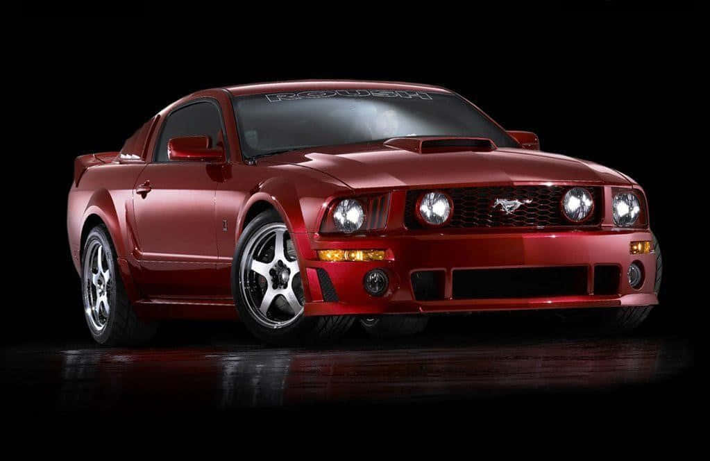 The Iconic Ford Mustang Roush in Action Wallpaper
