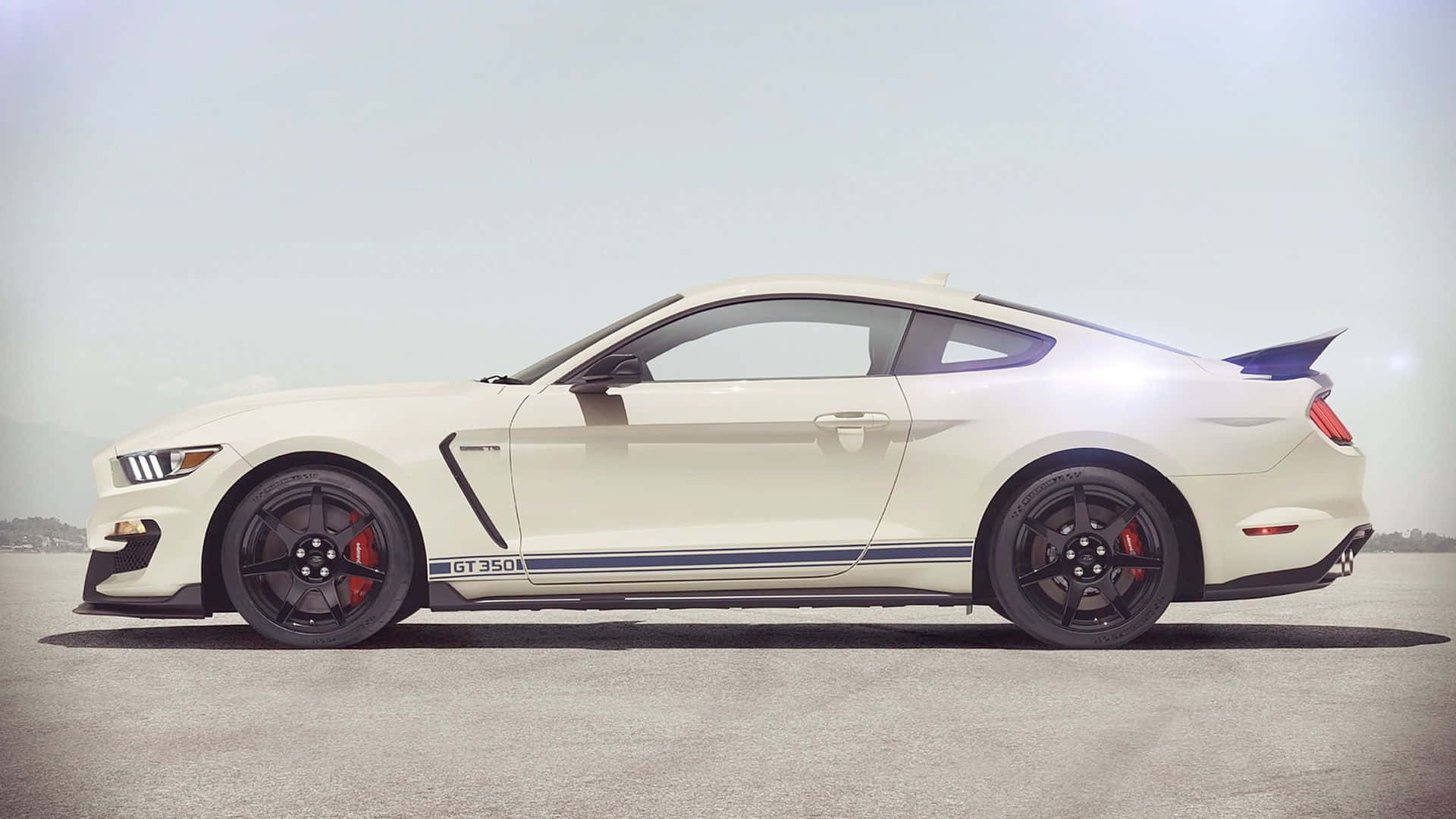 Sleek Ford Mustang Shelby GT350 in Motion Wallpaper