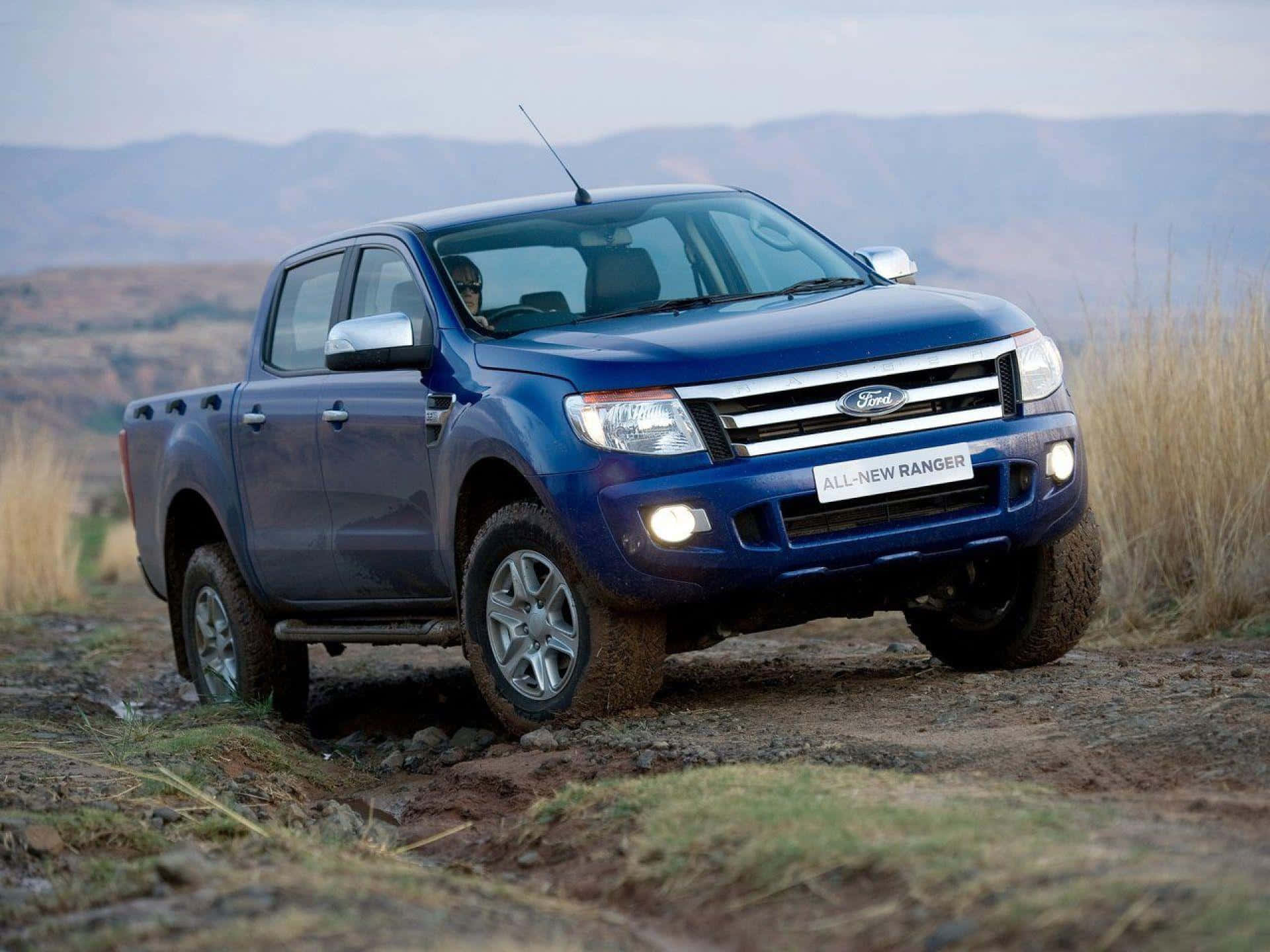 A powerful Ford Ranger in action on a rugged off-road trail Wallpaper