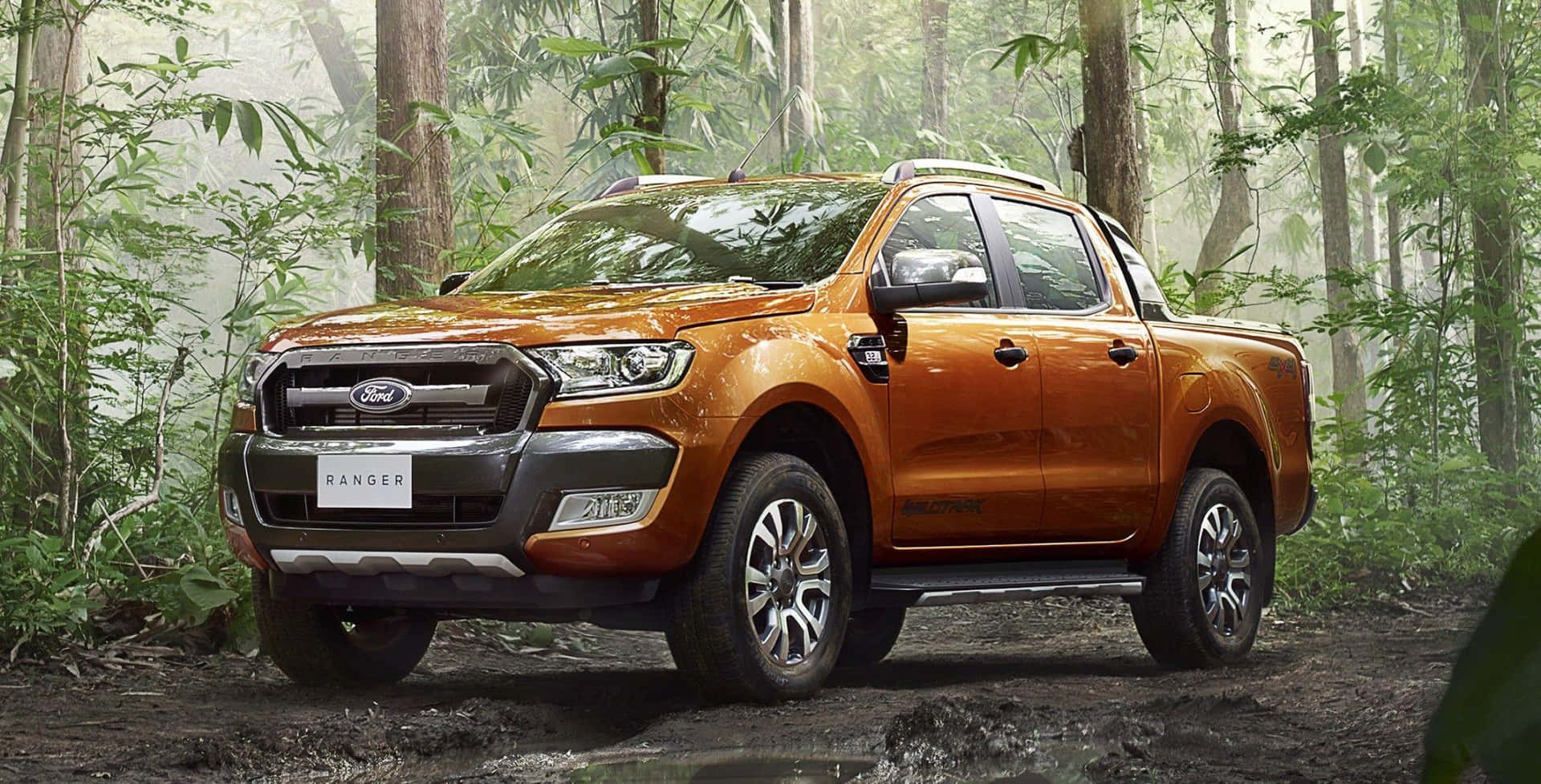 Sleek Ford Ranger cruising on an open road Wallpaper