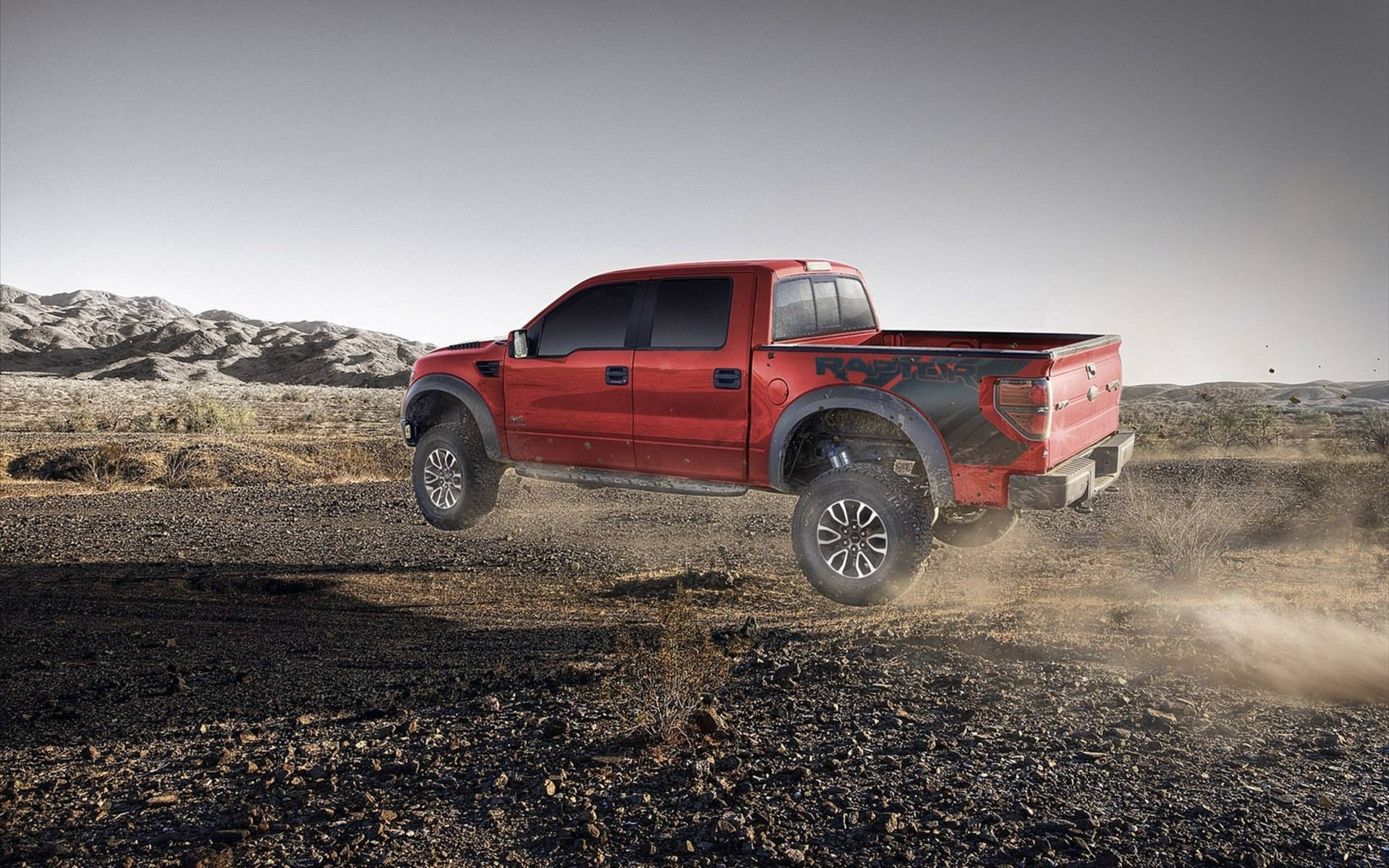 Ford Raptor Jumping Off Background