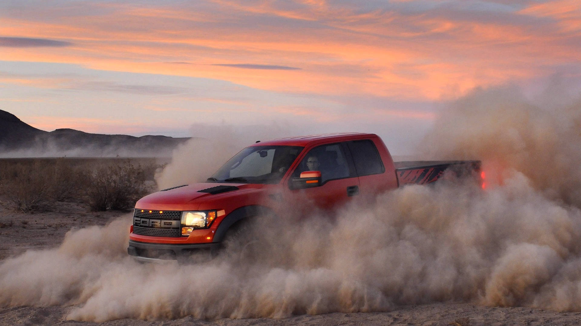 Ford Raptor Revving Dust Background