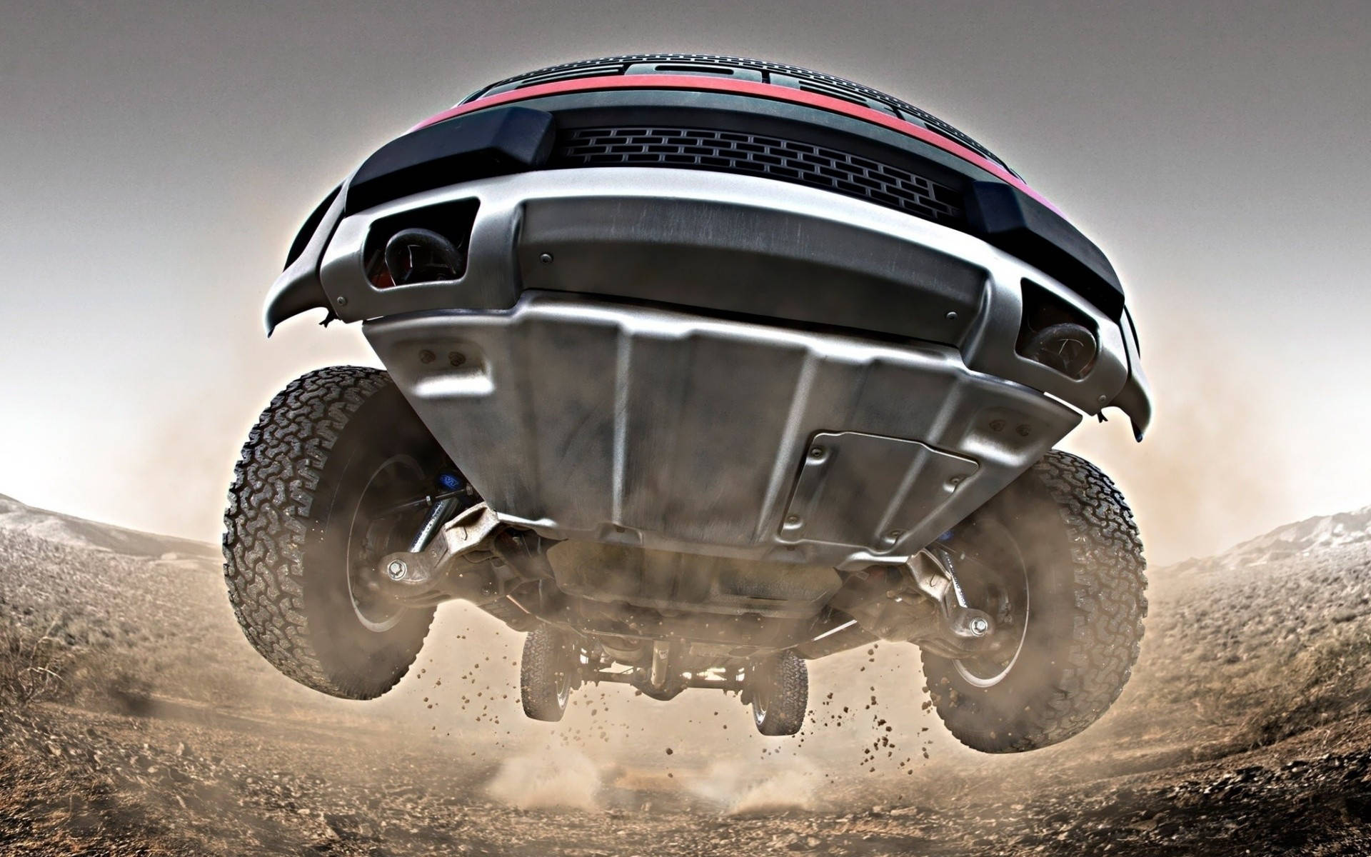 Caption: Dominating Engineering - Ford Raptor Under Chassis View Wallpaper