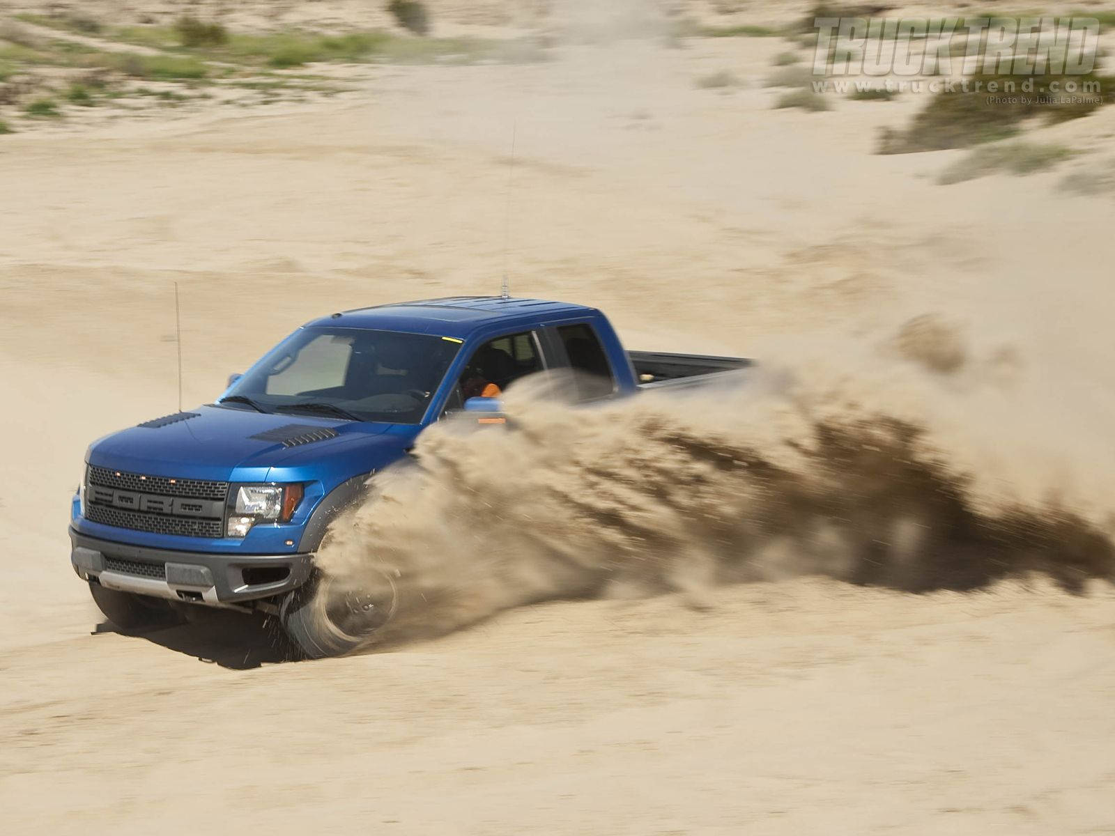Ford Raptor With Dust Flying Wallpaper
