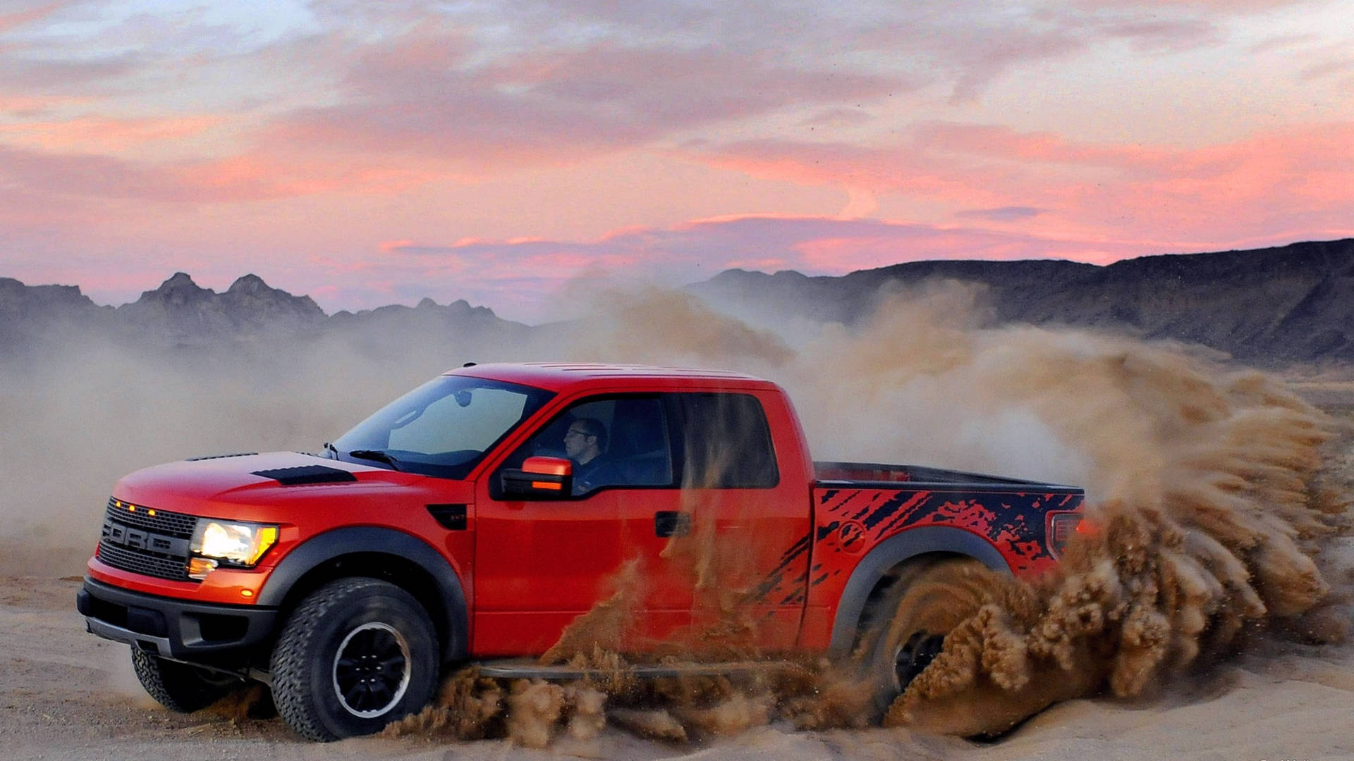 Ford Raptor With Dust Trail Background