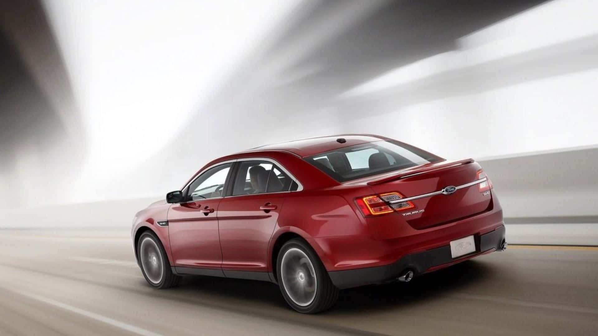 Captivating Ford Taurus in Action Wallpaper