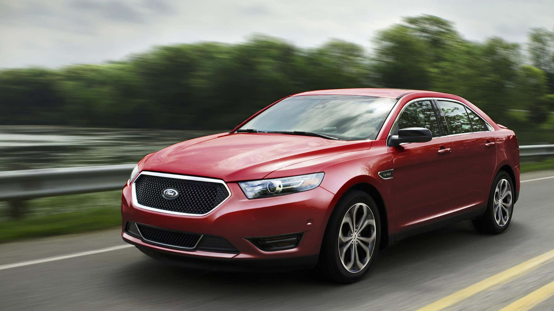 Sleek and Stylish Ford Taurus in Motion Wallpaper