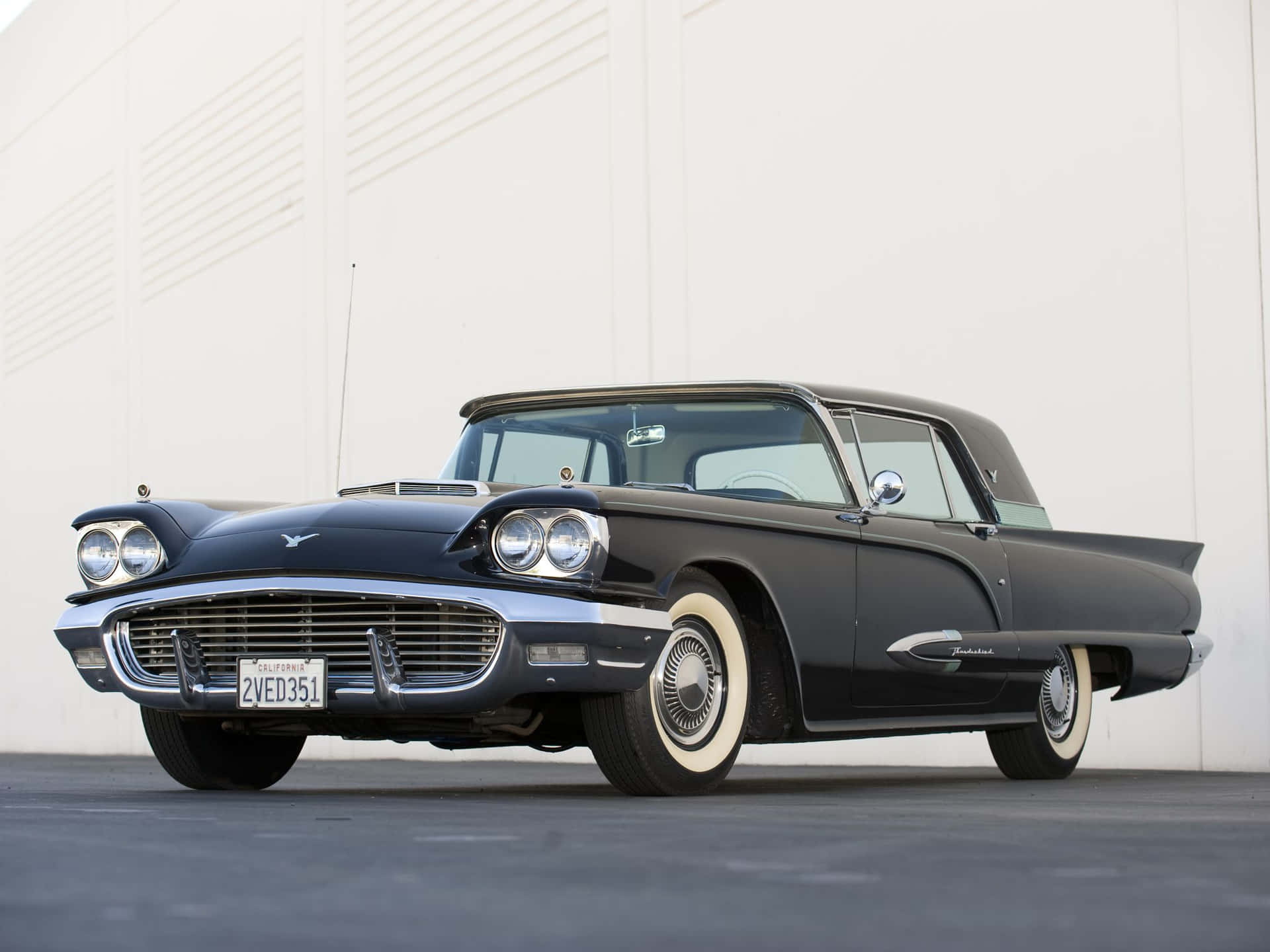Classic Ford Thunderbird on the open road Wallpaper