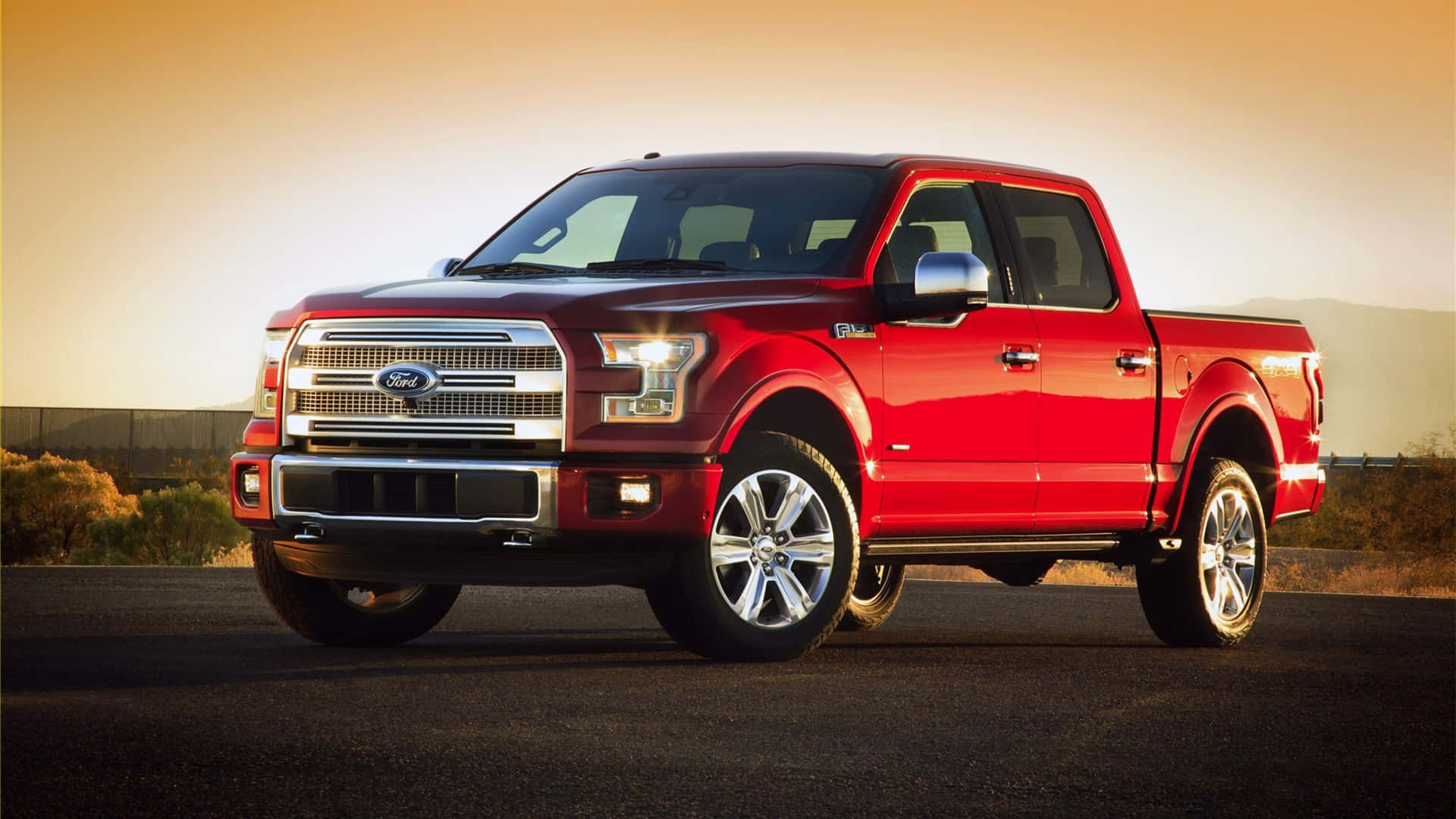 The Red Ford F - 150 Is Parked On A Desert Road Wallpaper