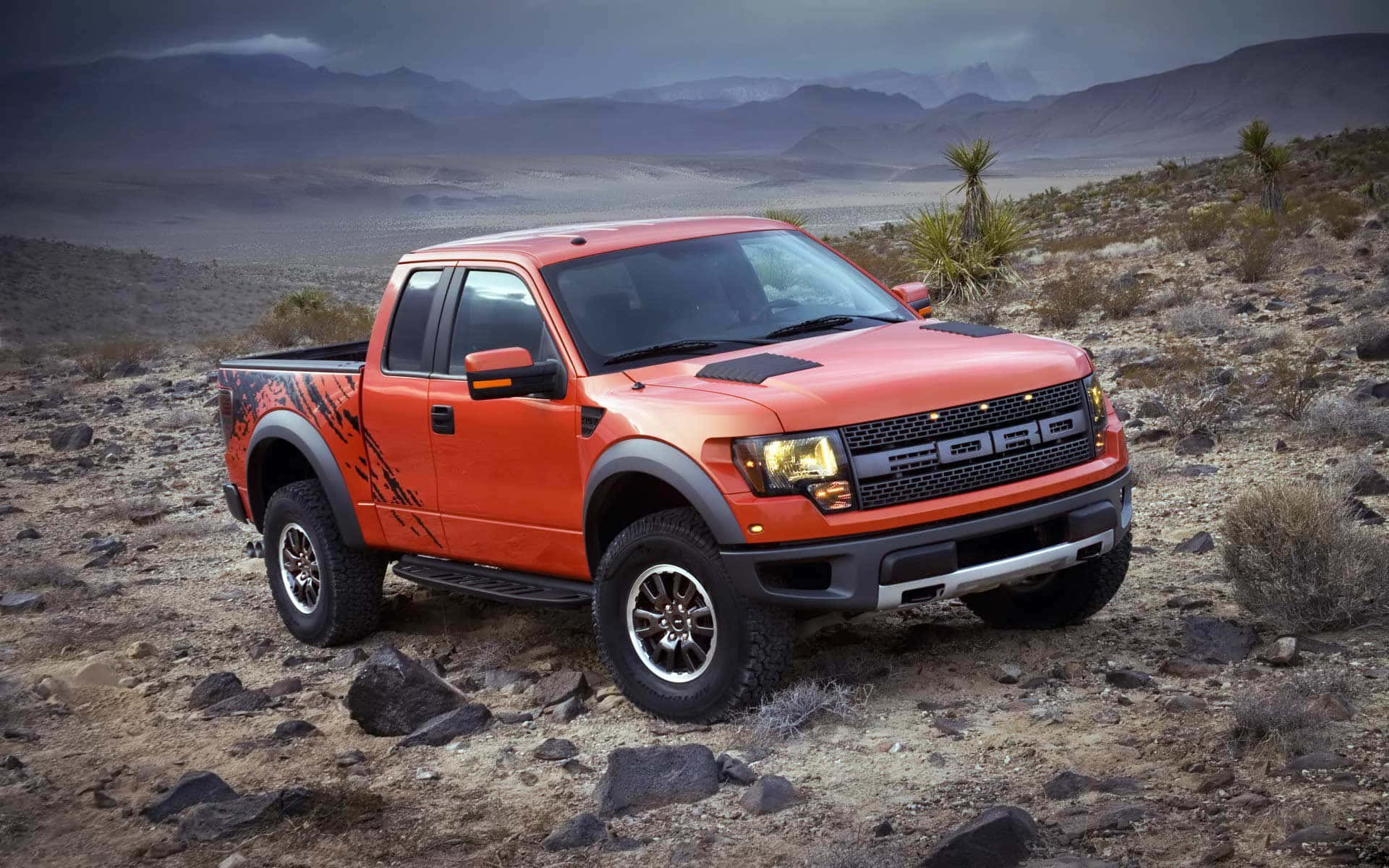 The Ford F - 150 Raptor Is Parked In The Desert Wallpaper