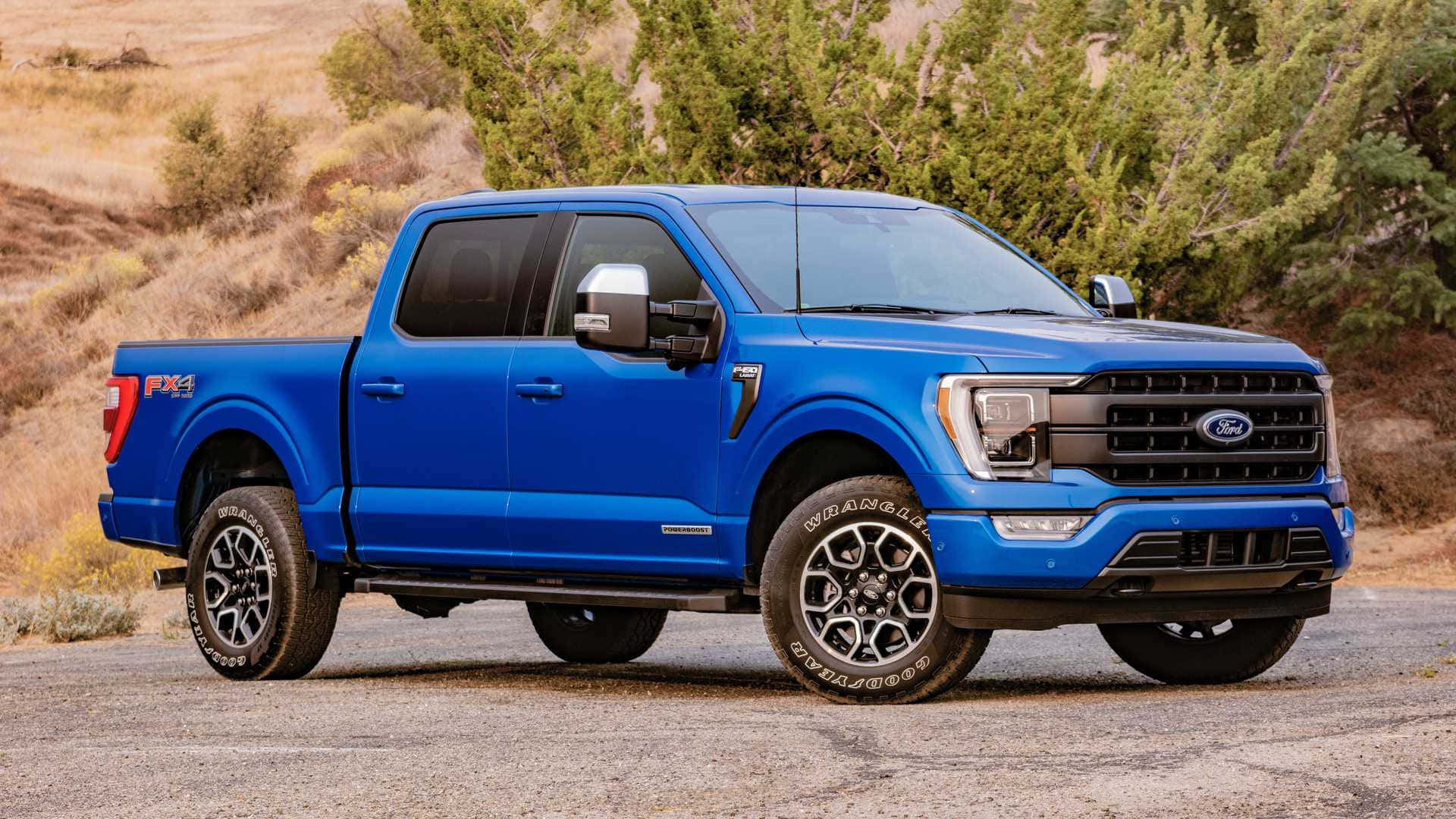 The Blue 2020 Ford F - 150 Is Parked On A Dirt Road