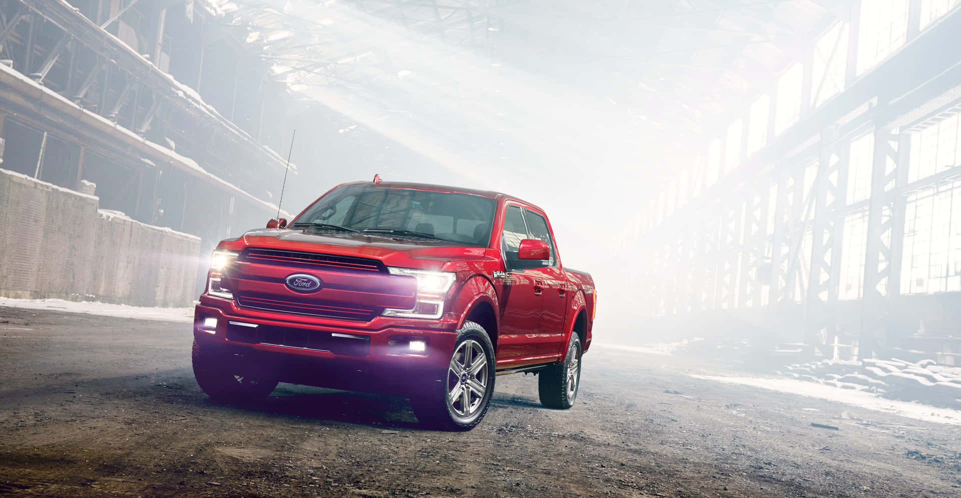 The Red Ford F-150 Is Driving Through An Industrial Building Wallpaper