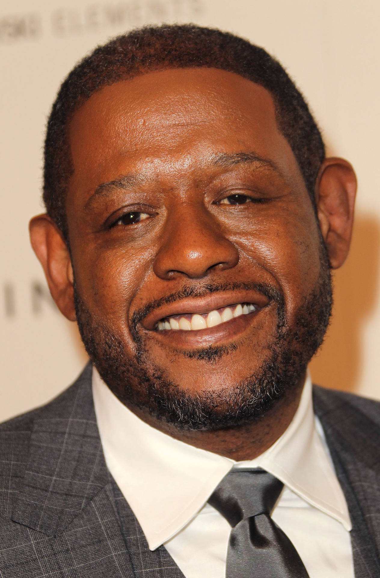 Renowned Actor Forest Whitaker in Elegant Grey Plaid Suit Wallpaper