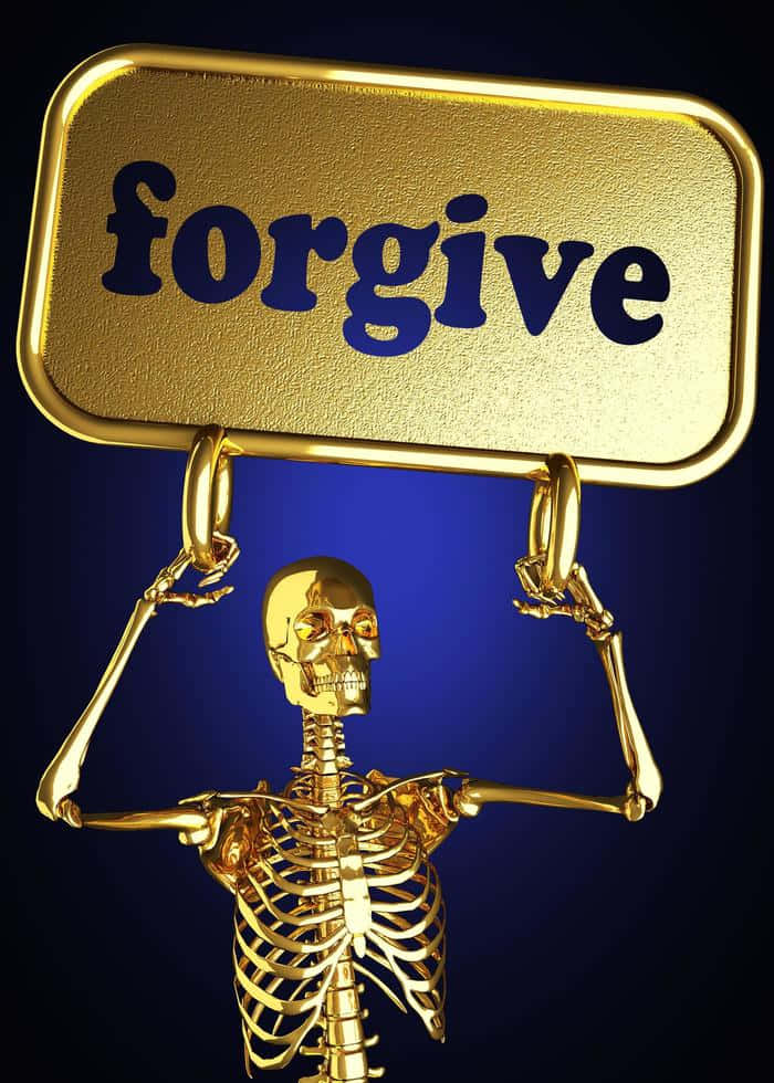 A Skeleton Holding A Gold Sign That Says Forgive