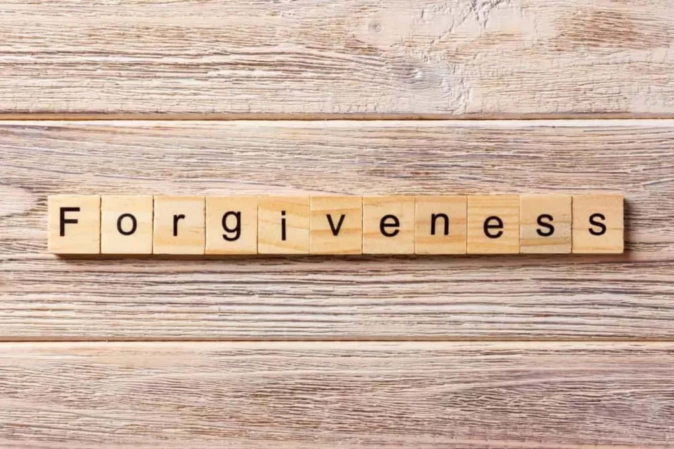 Forgiveness Scrabble Letters On Wooden Background