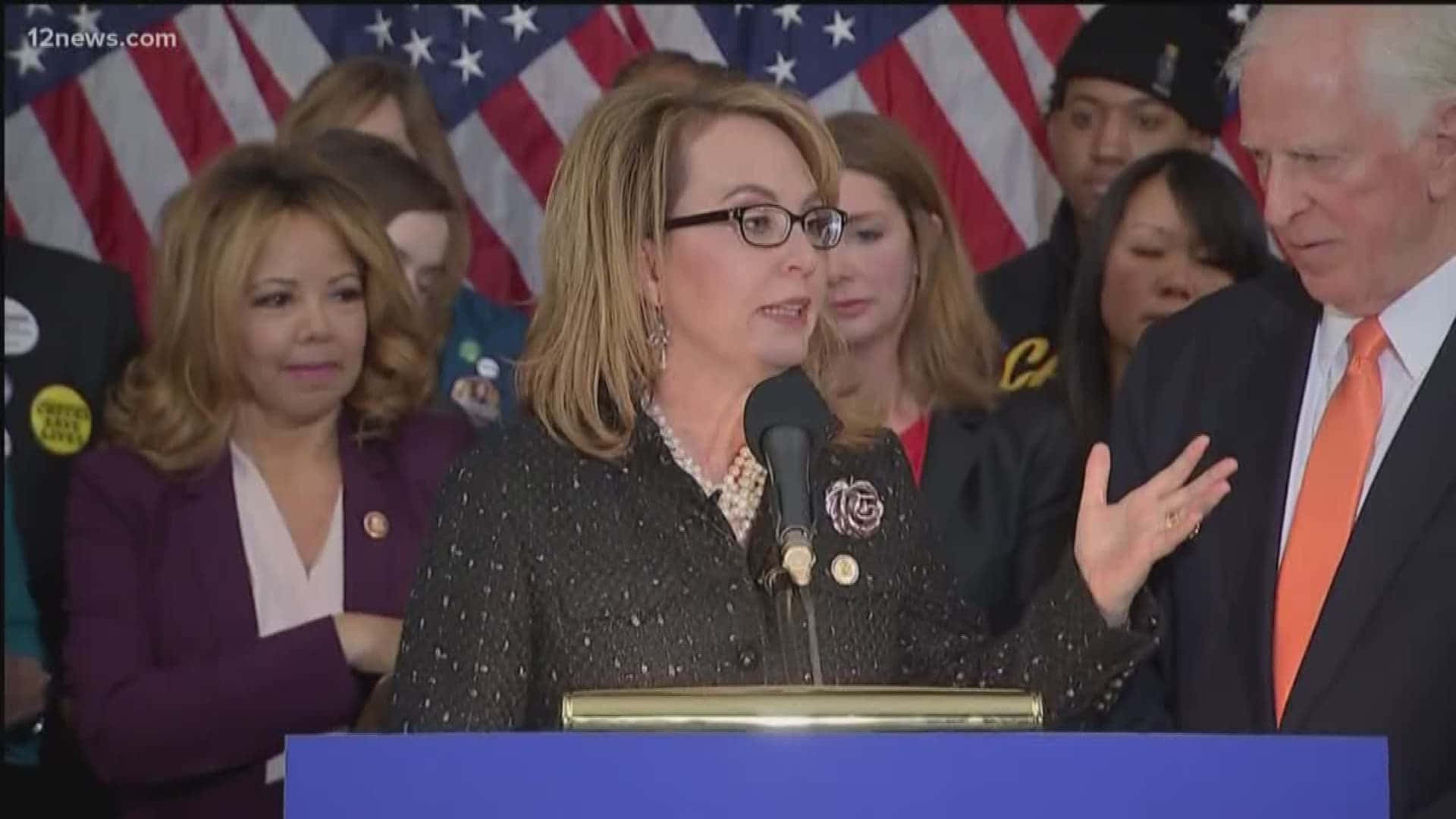 Former Us Congresswoman Gabrielle Giffords Giving A Speech Wallpaper