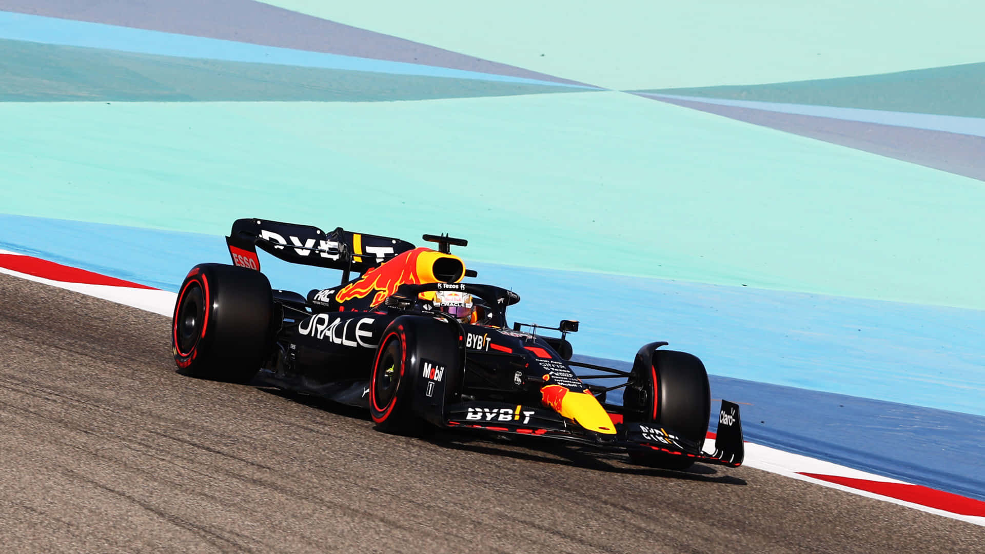 A Red Bull Racing Car On A Track Wallpaper