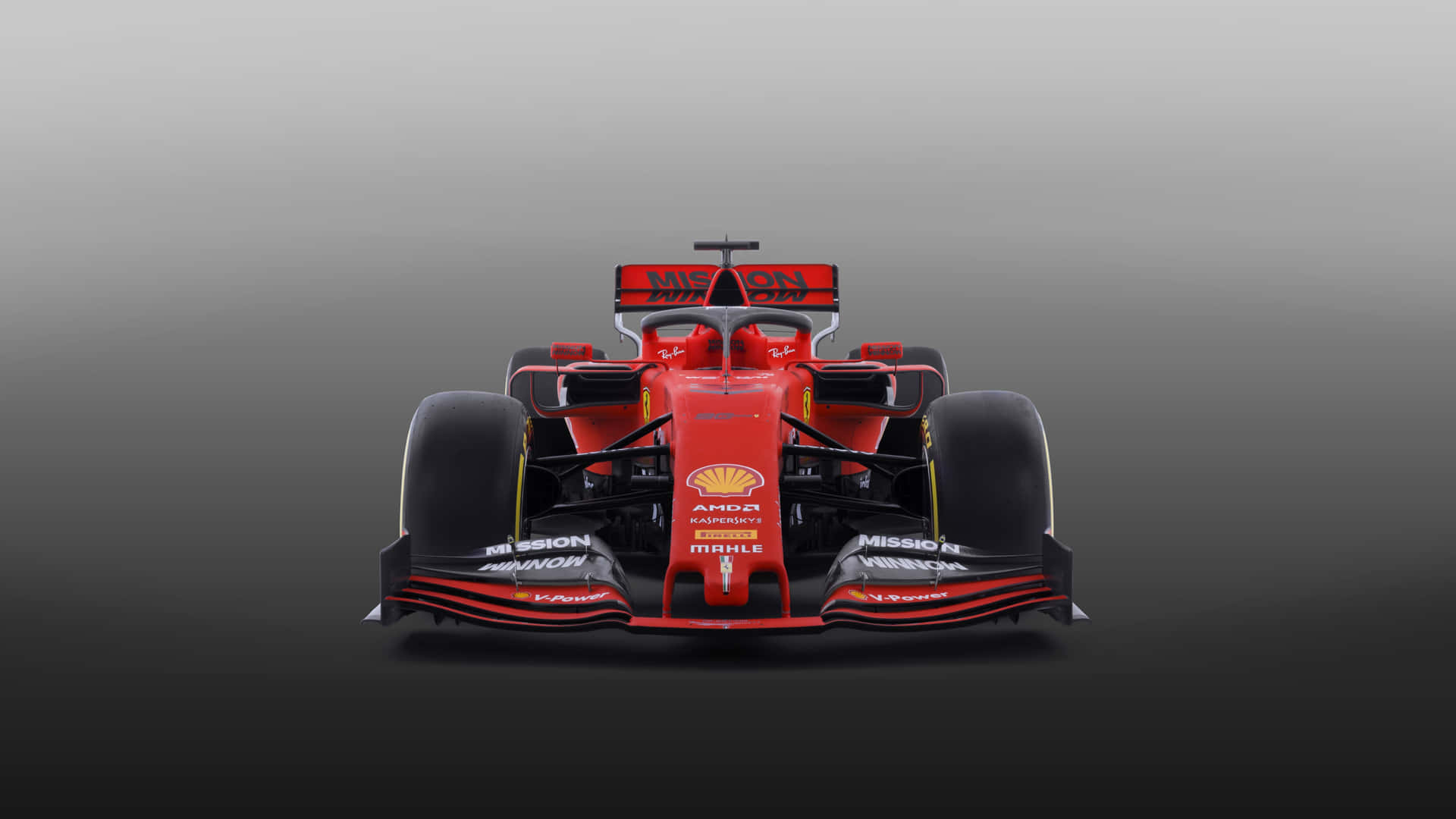 En Ferrari F1 bil i rød på en grå baggrund. Wallpaper