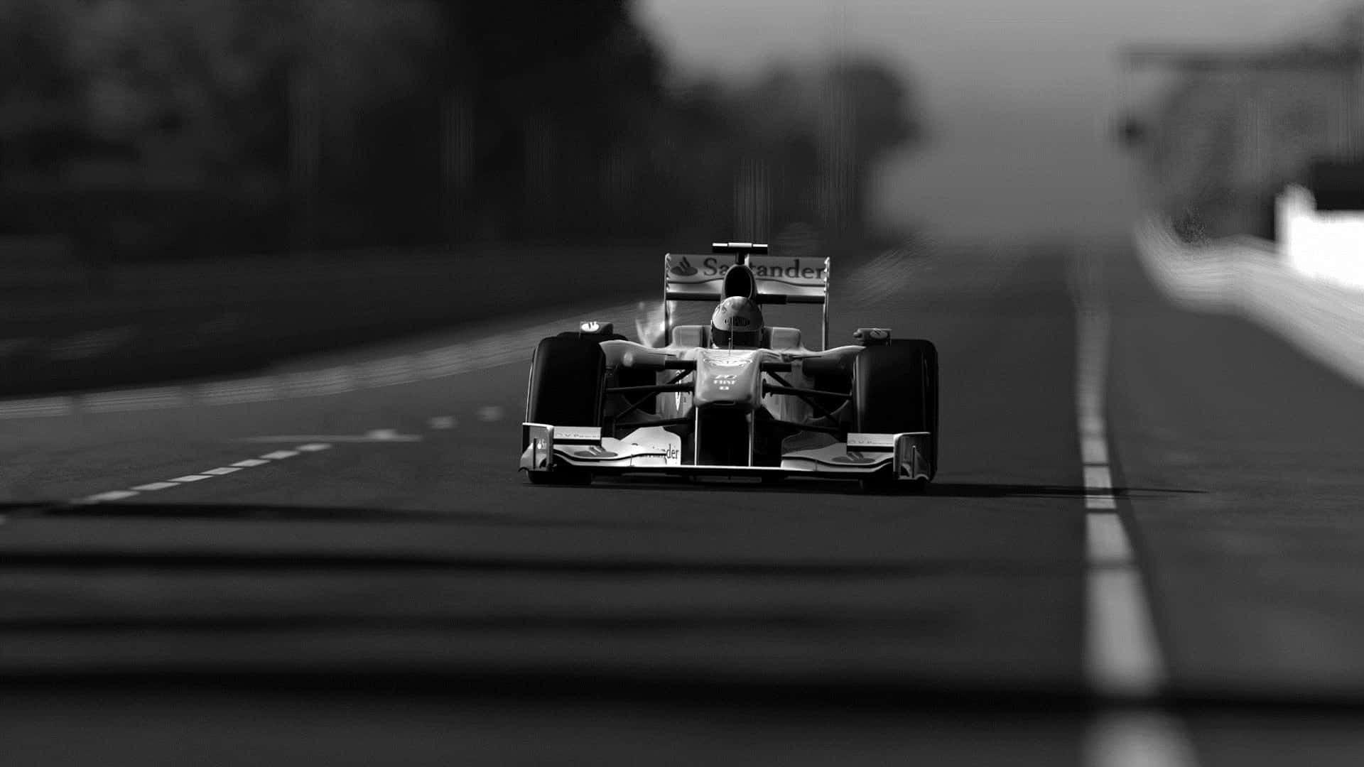 A Black And White Photo Of A Racing Car On A Road Wallpaper