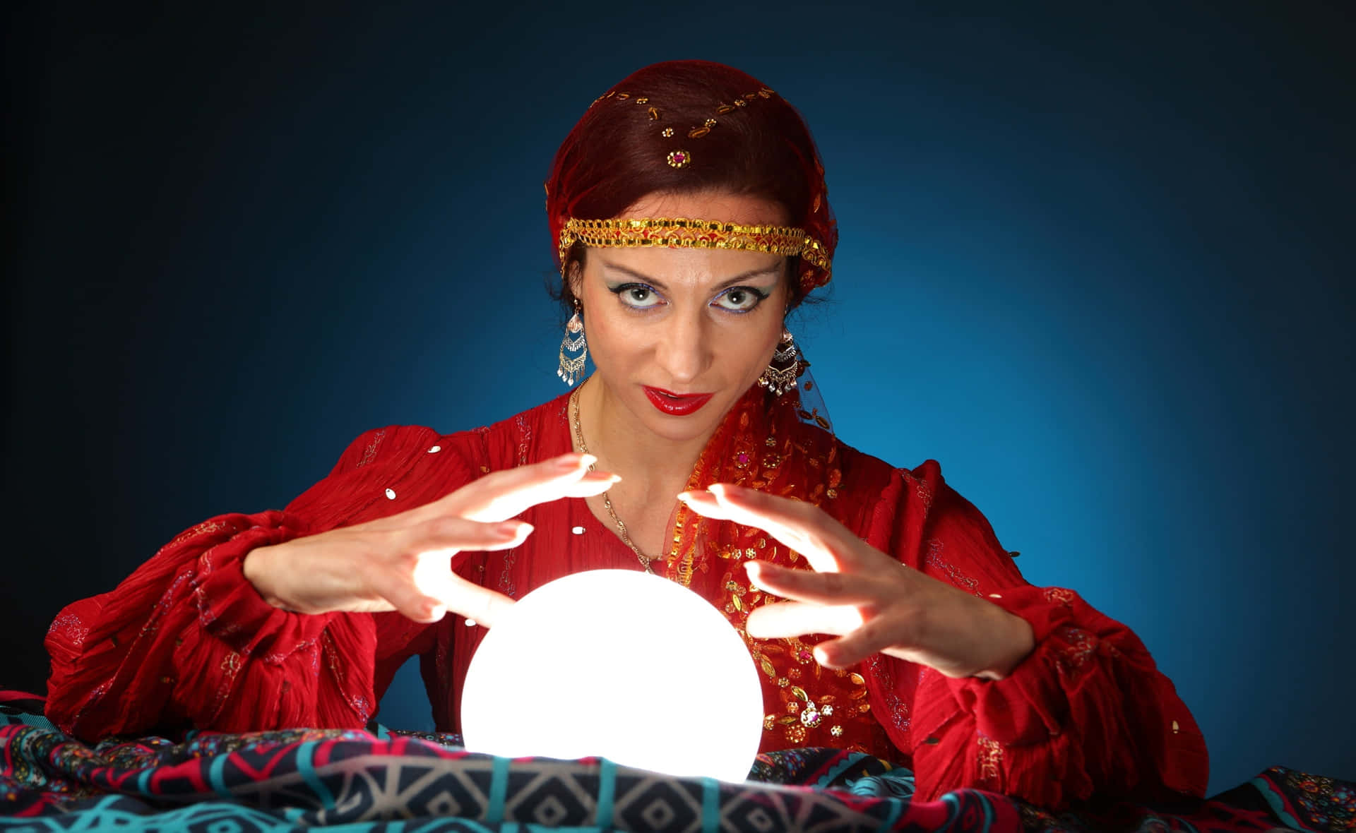 Mysterious Fortune Teller with Glowing Crystal Ball Wallpaper
