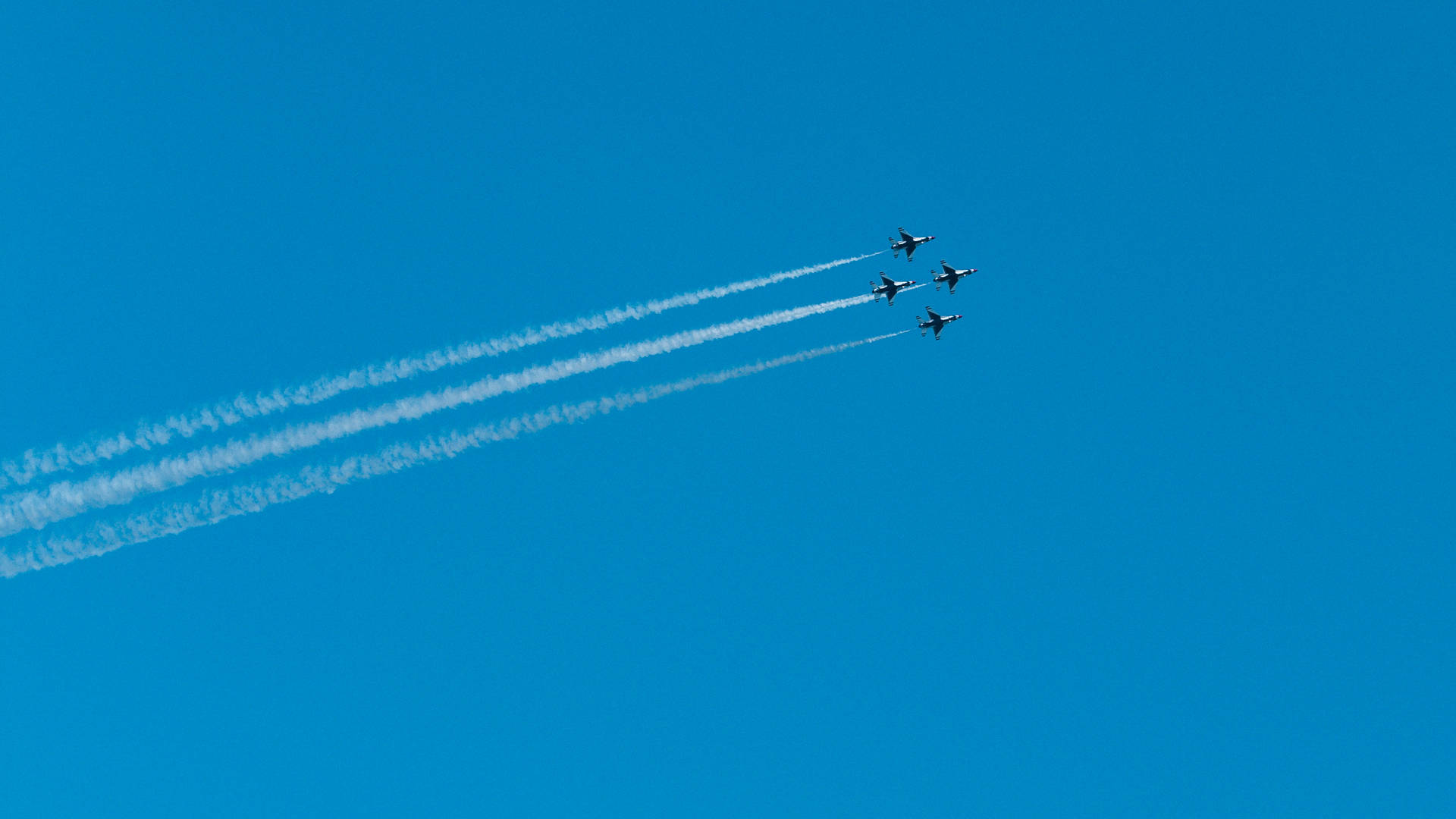 Four Fighter Jets In Plain Blue