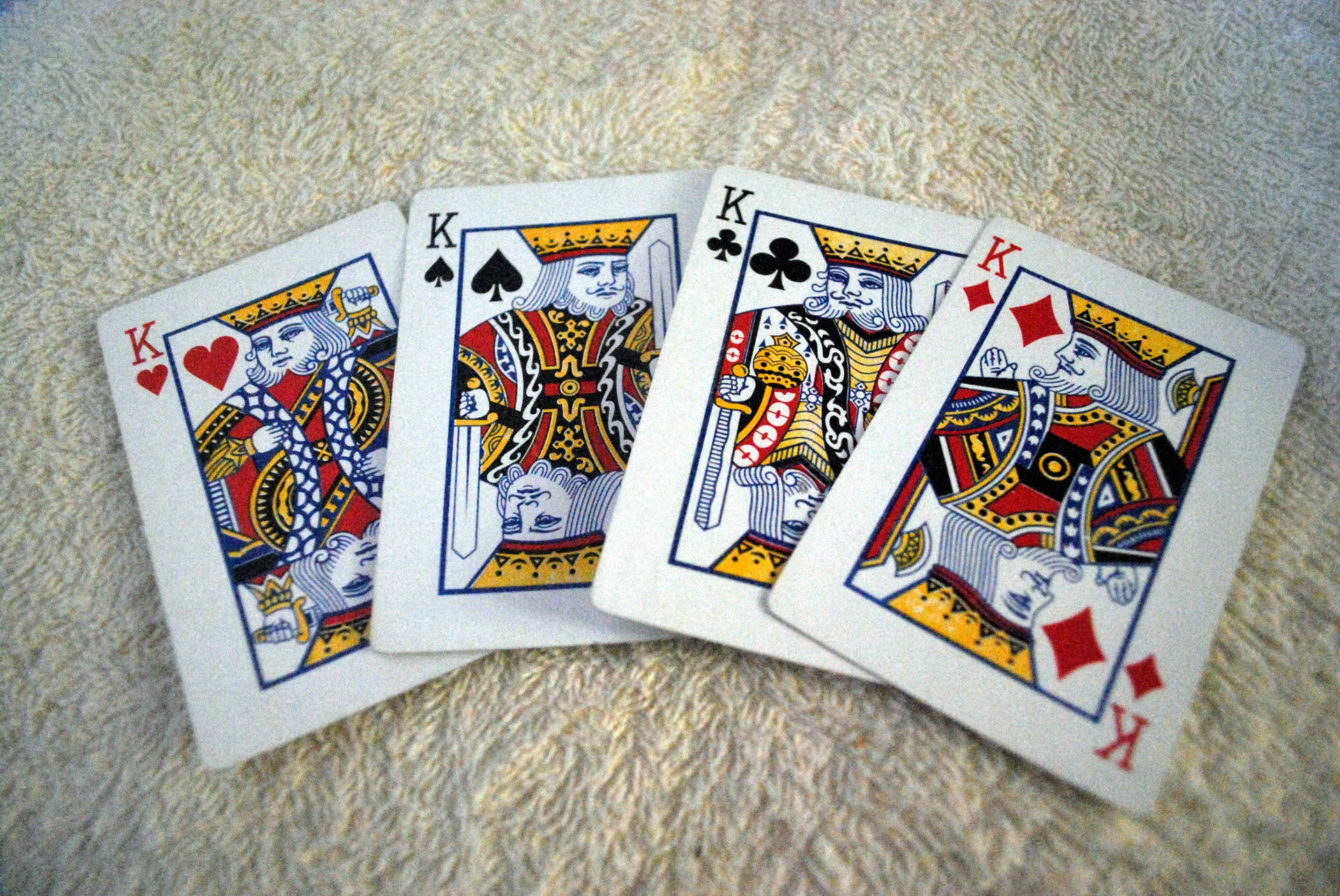 Fireværk af fire konger spillekort tæppe Wallpaper