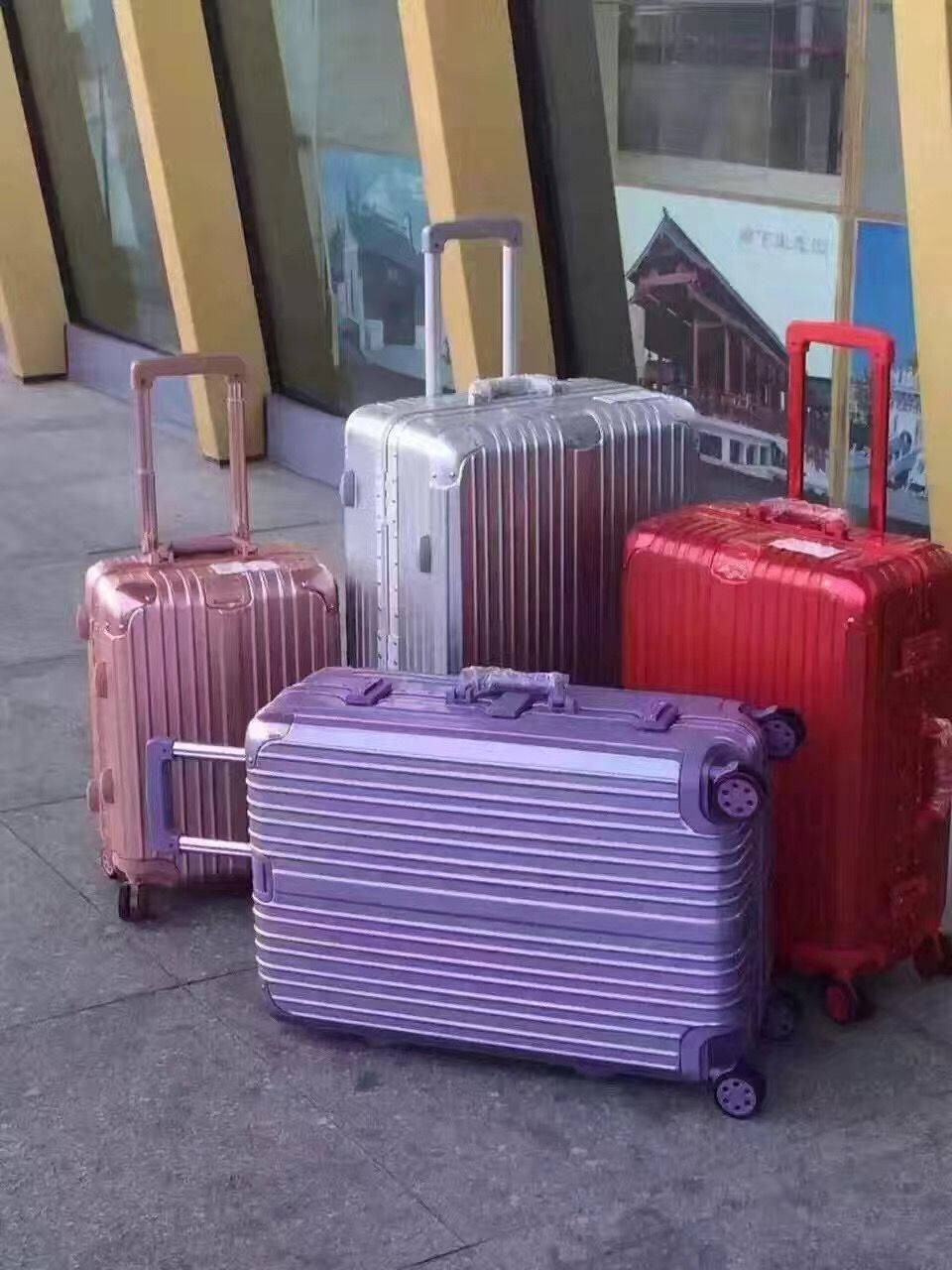 Four Rimowa Suitcases Wallpaper
