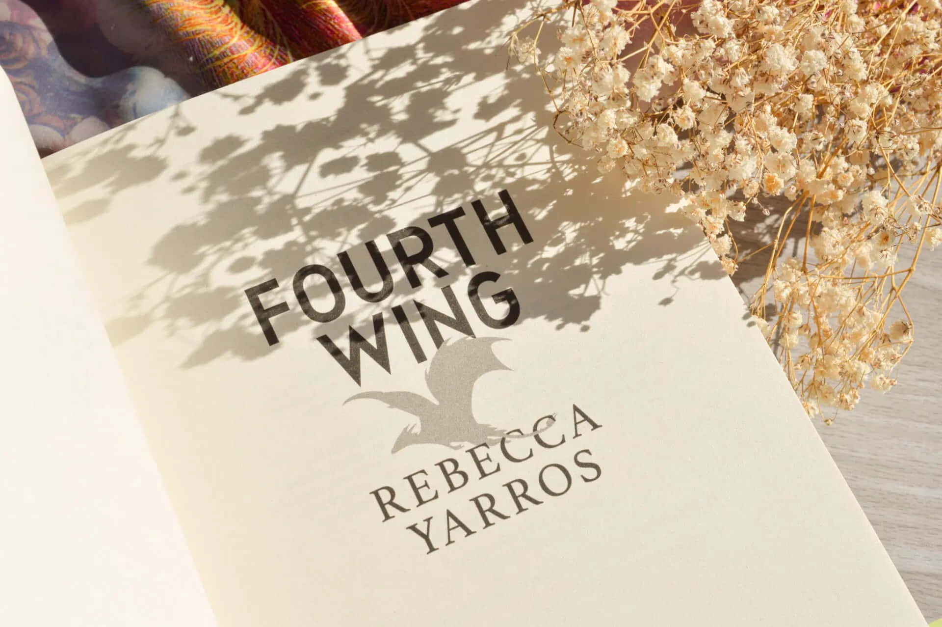 Fourth Wing Book Coverwith Floral Shadow Wallpaper