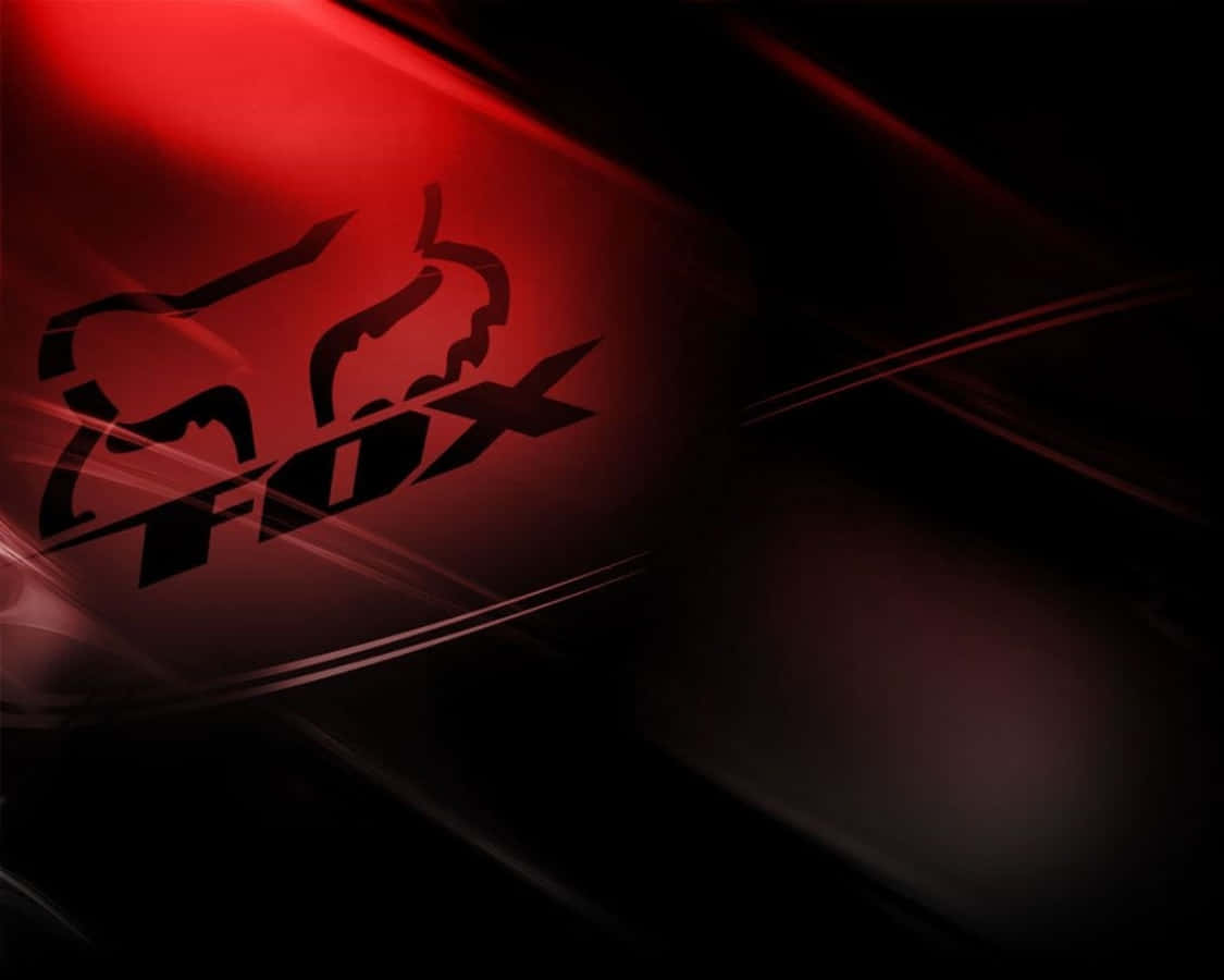 Et fox racing logo på en sort baggrund Wallpaper