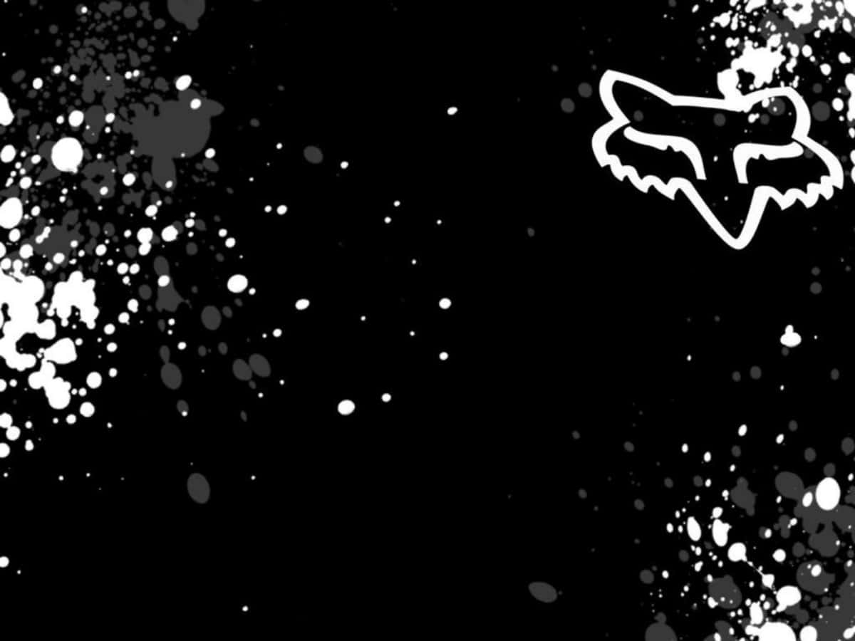 Et Fox Racing logo på en sort baggrund Wallpaper
