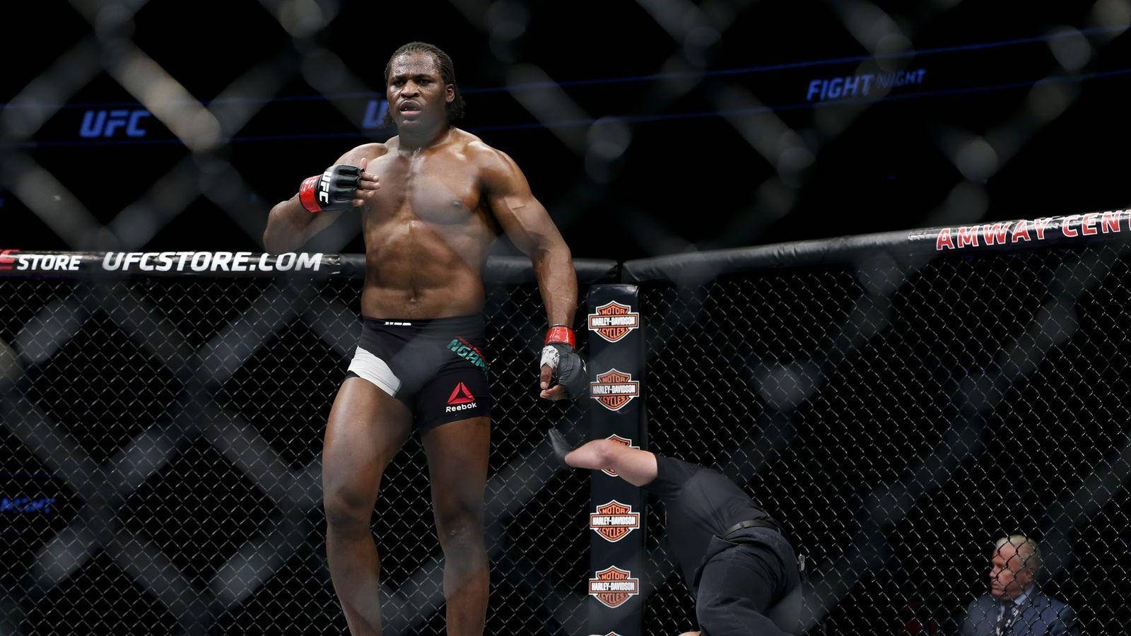 Francis Ngannou Hand On Chest Background
