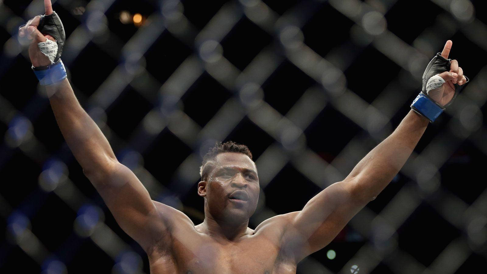 Francis Ngannou Segrande. (in The Context Of Computer Or Mobile Wallpaper, This Could Be Used As A Caption Or Title For An Image Featuring Francis Ngannou Triumphing In A Fight.) Wallpaper