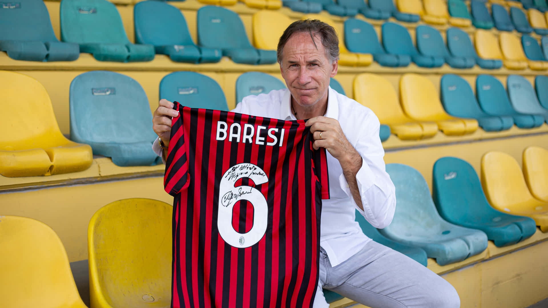 Franco Baresi Holding His Signed Jersey Background