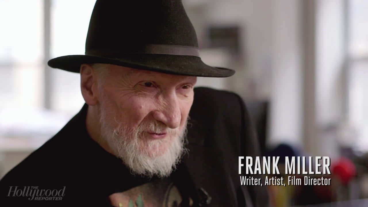 Acclaimed comic book writer Frank Miller holding a pen and sketchbook Wallpaper