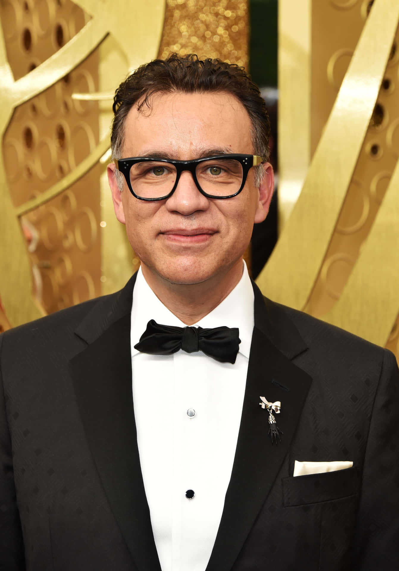 Fred Armisen Delighting With A Comedic Gesture On Stage Wallpaper