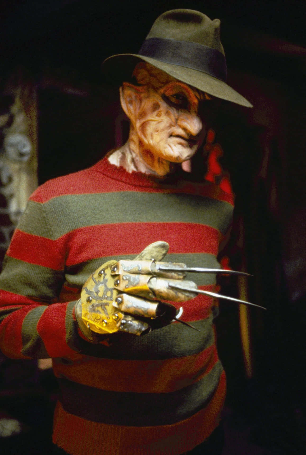 Freddy Krueger In A Hat And Sweater Holding A Knife