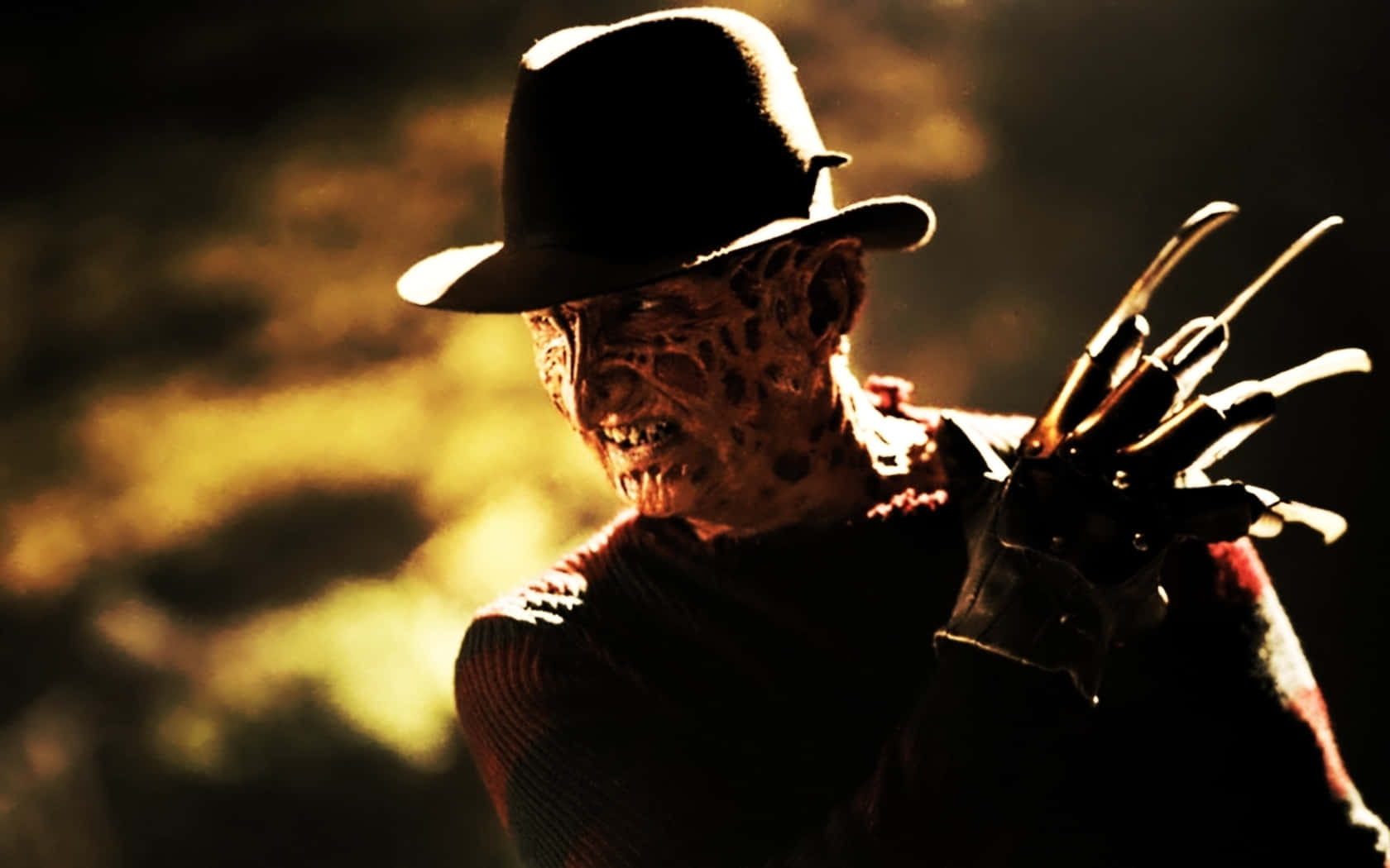 Caption: The iconic Freddy Krueger standing menacingly in the darkness
