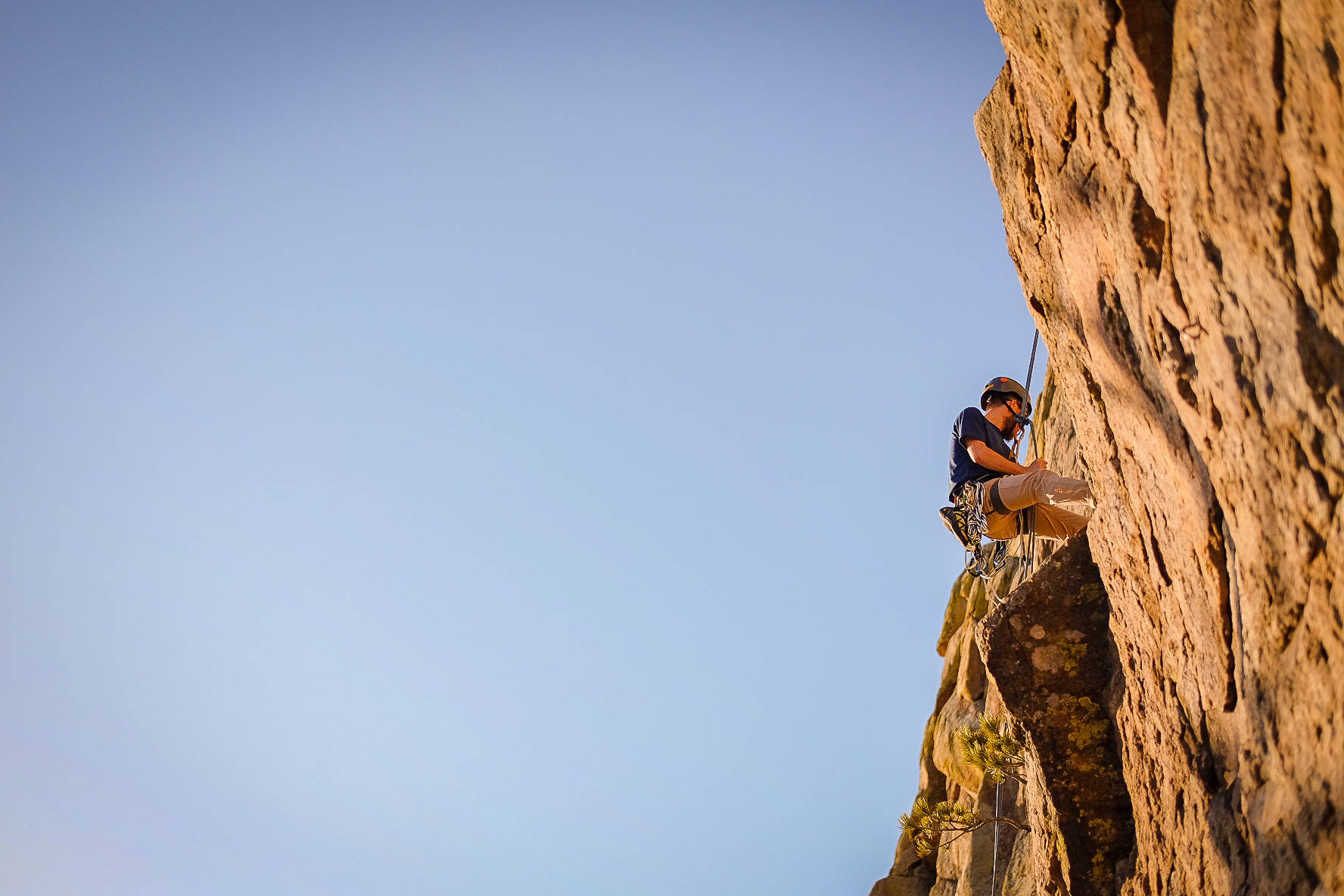 Athletic Endeavor - A Solo Sport Climber Scaling Heights Wallpaper