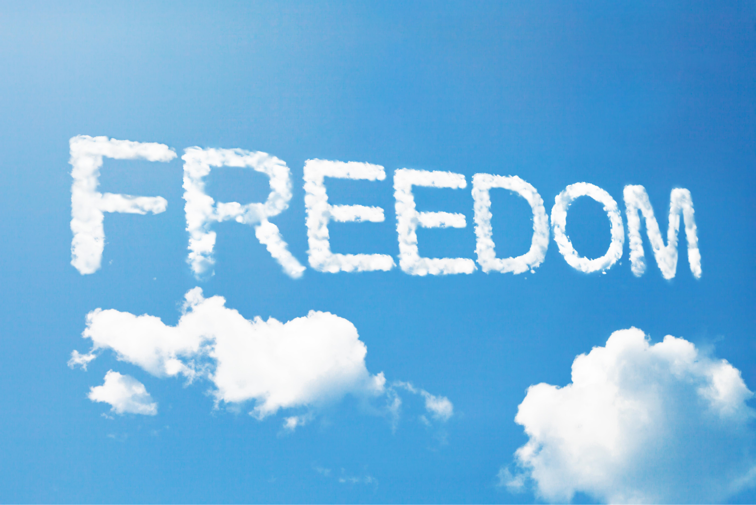 The Word Freedom Written In Clouds