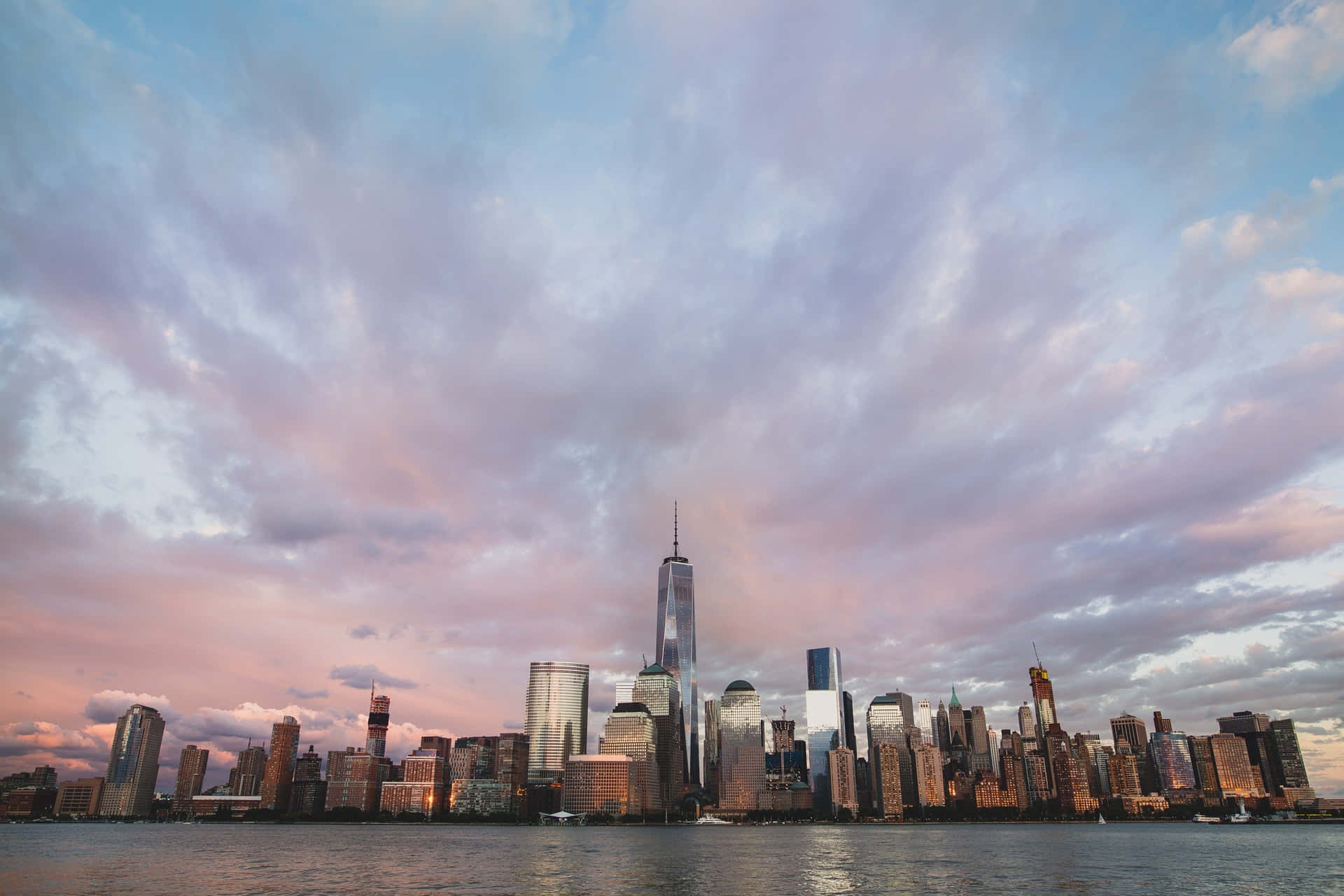 Freedom Tower New York Skyline Under Purple Clouds Wallpaper