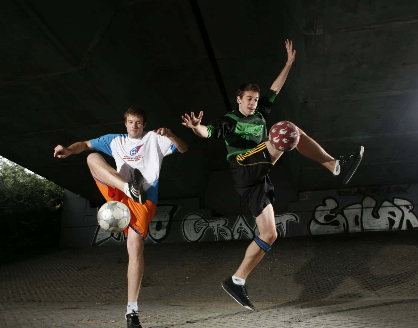 Freestyle Soccer Duo Performing Tricks Wallpaper