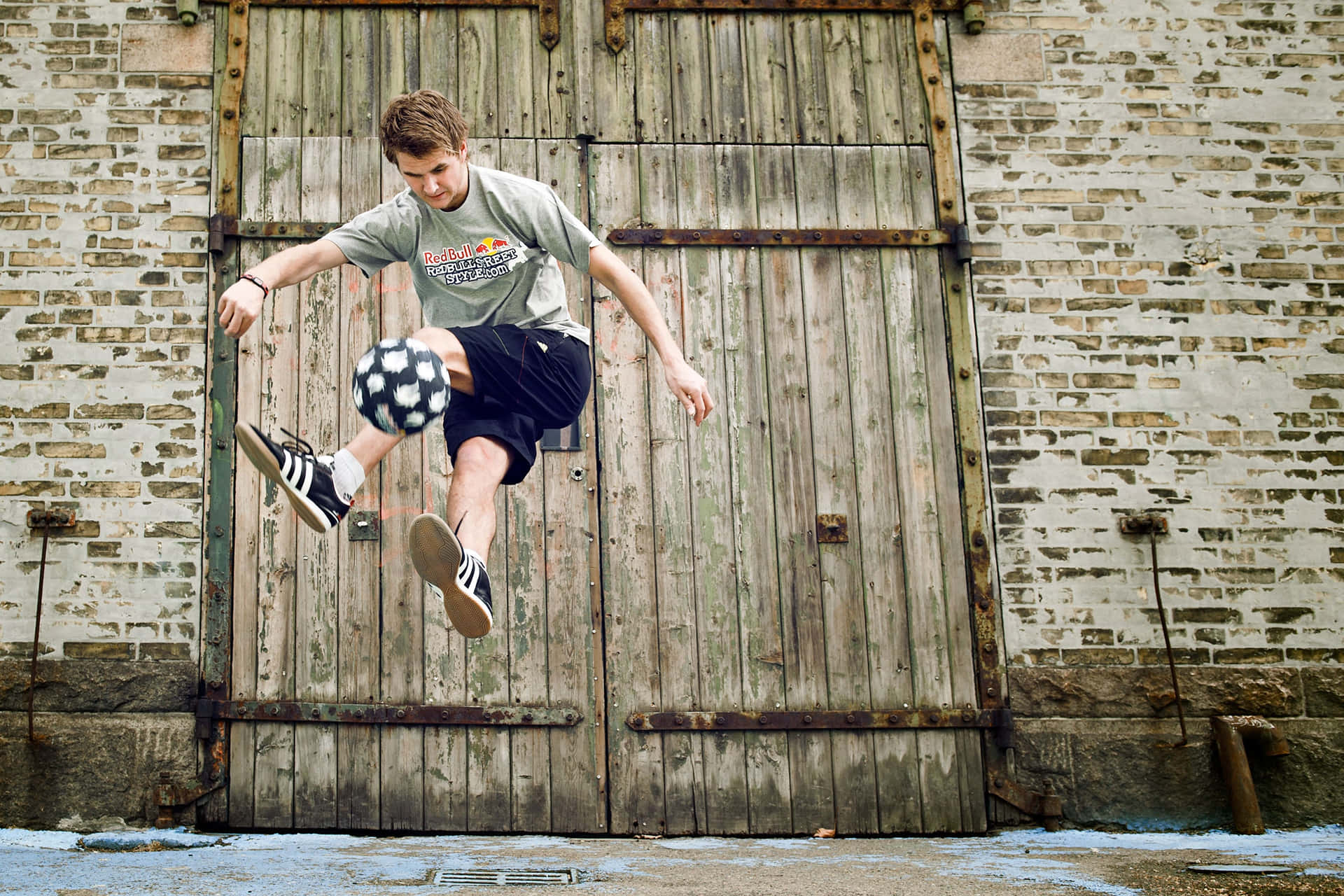 Freestyle Soccer Trick Against Rustic Door.jpg Wallpaper