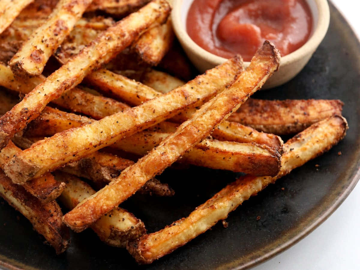 Indulge in the Pleasure of Golden Perfection with Crispy French Fries