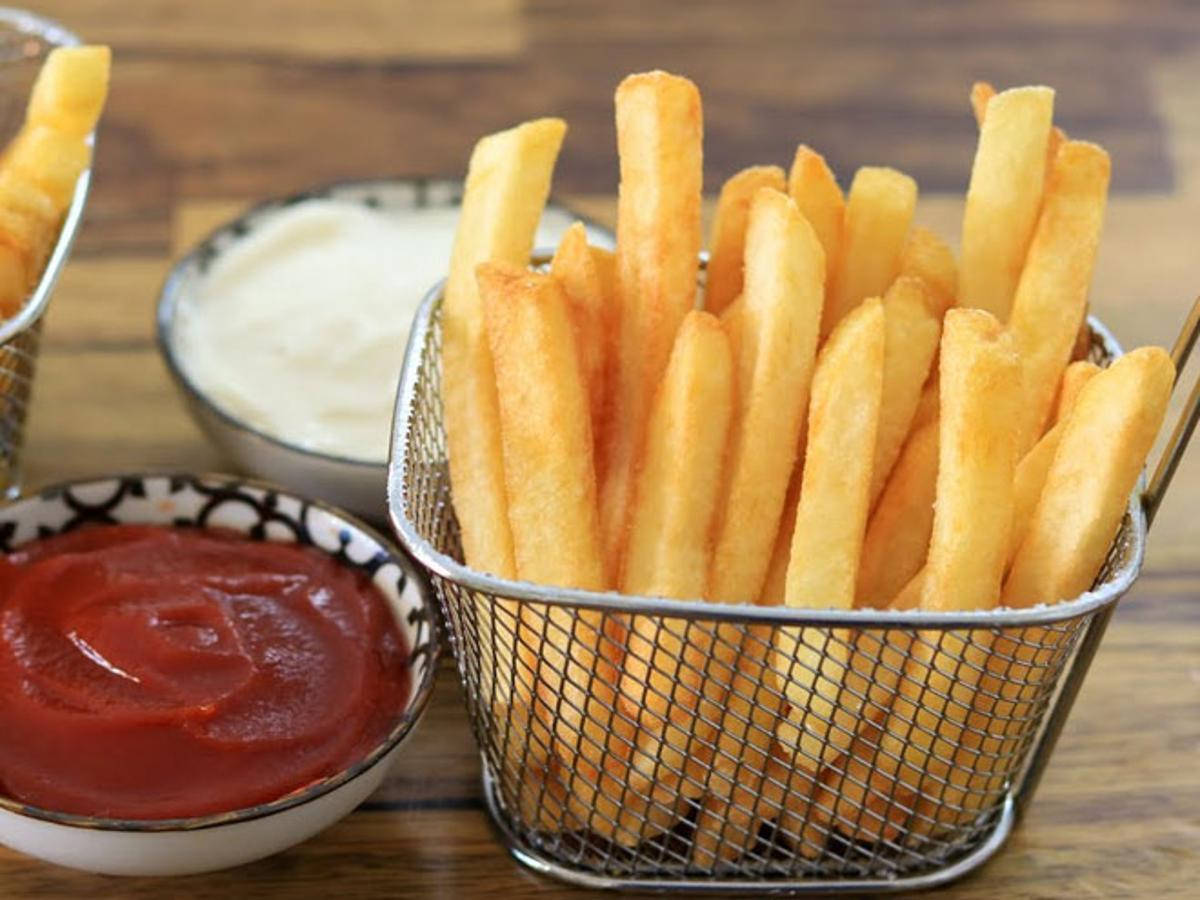 Delectable Golden French Fries in a Basket Wallpaper