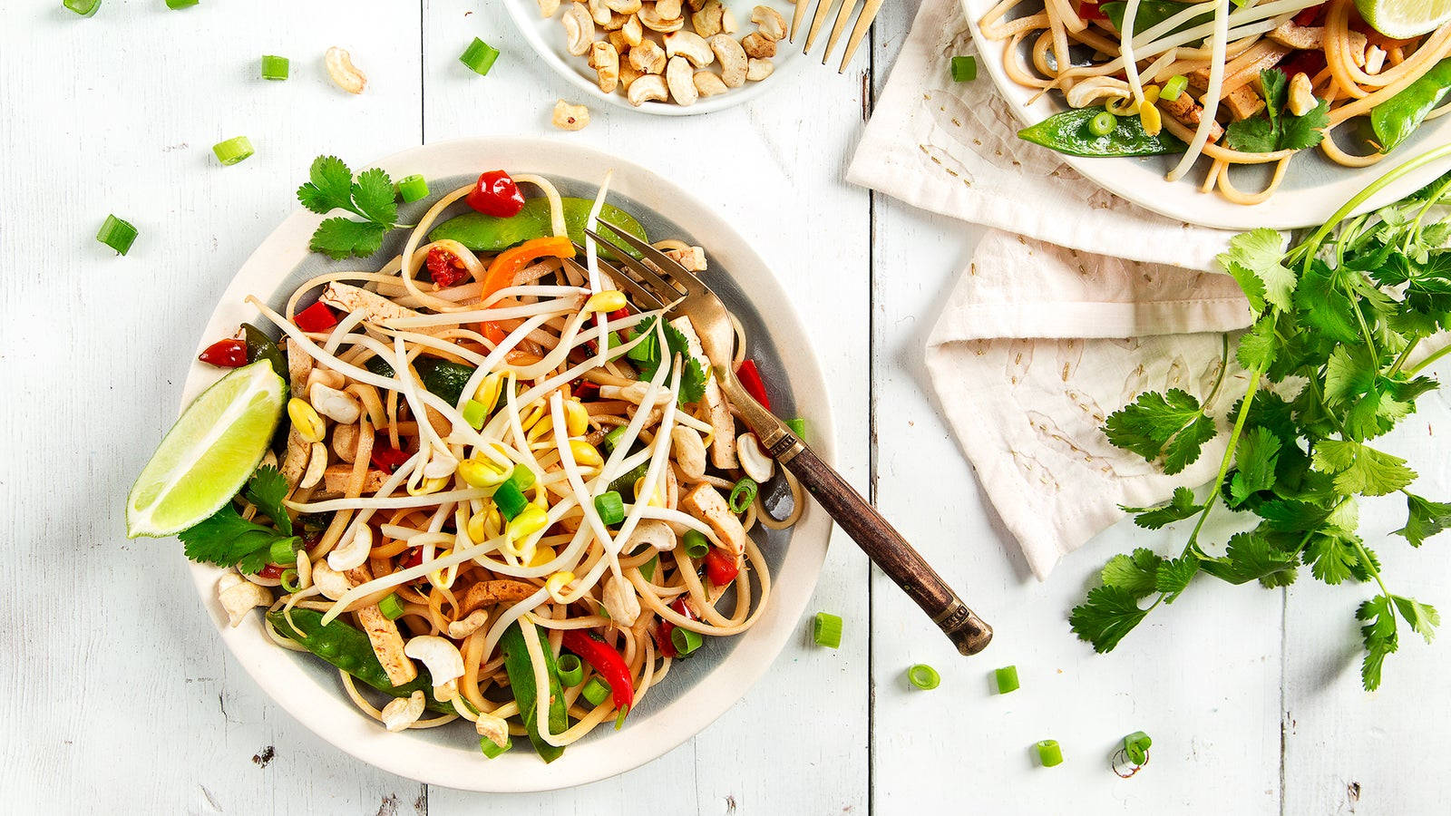 Download Fresh Bowl Of Pad Thai With Scallions Wallpaper | Wallpapers.com