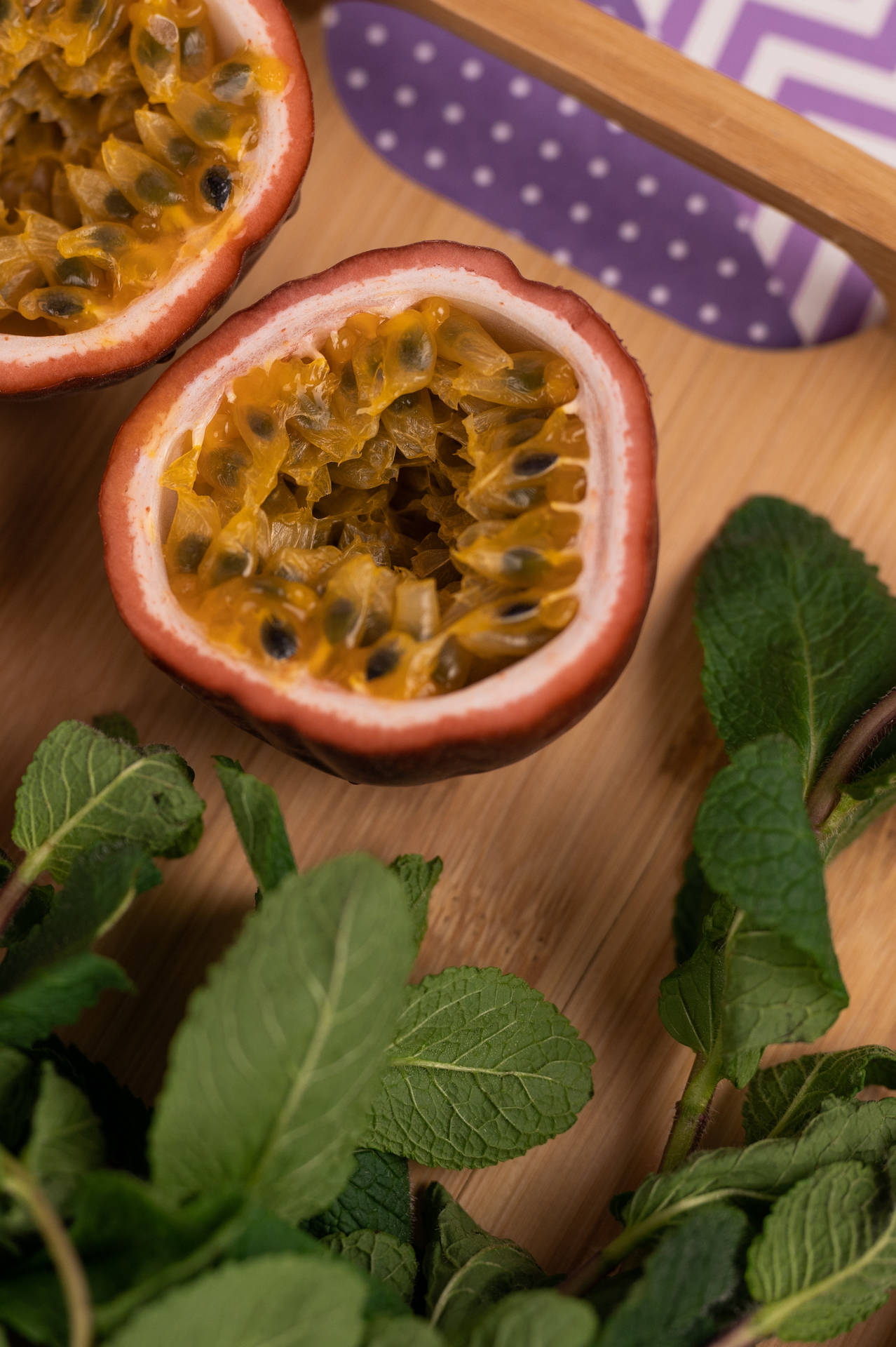 Fresh Cut Passion Fruit With Leaves Wallpaper