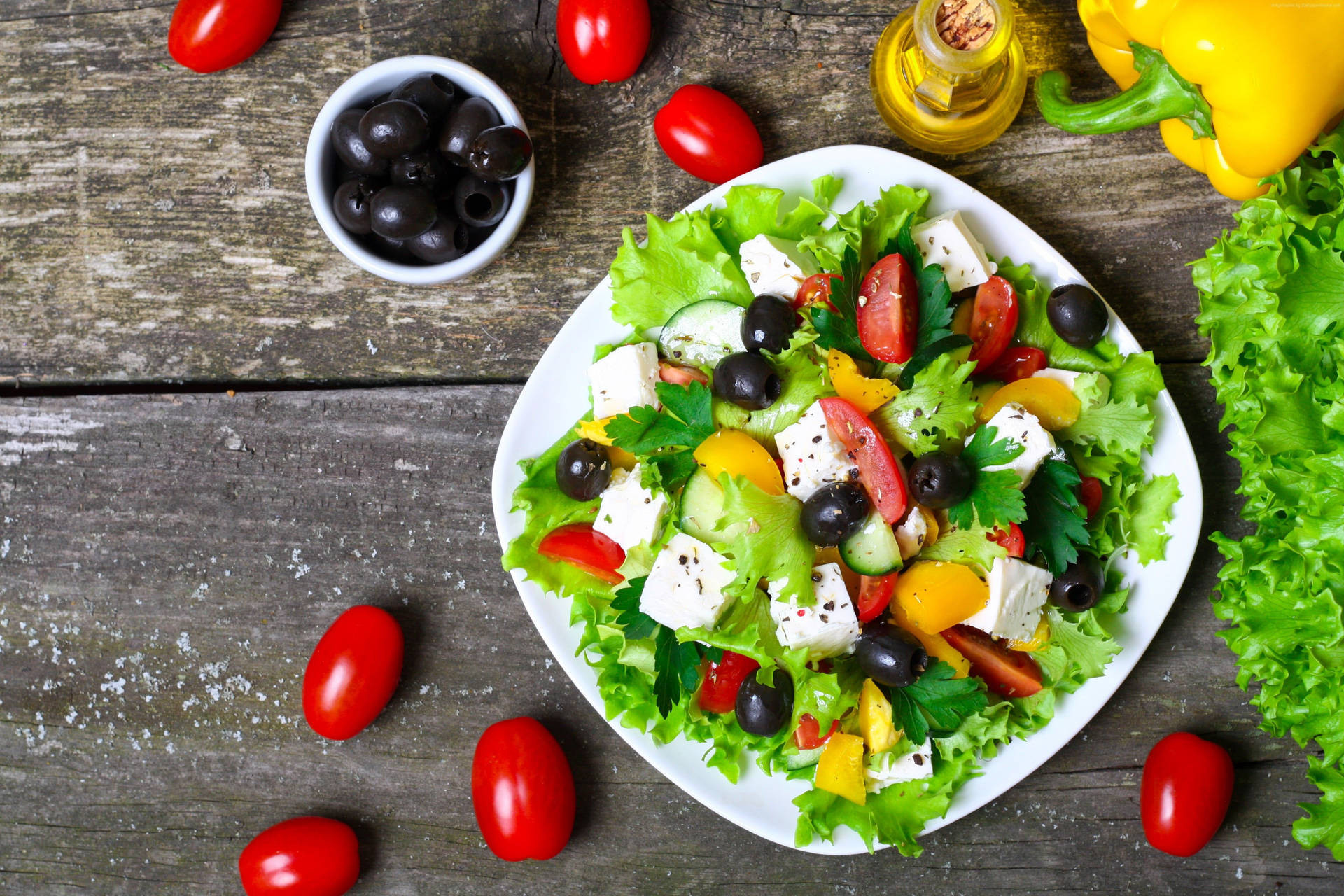 Savour the goodness of this freshly prepared healthy salad Wallpaper