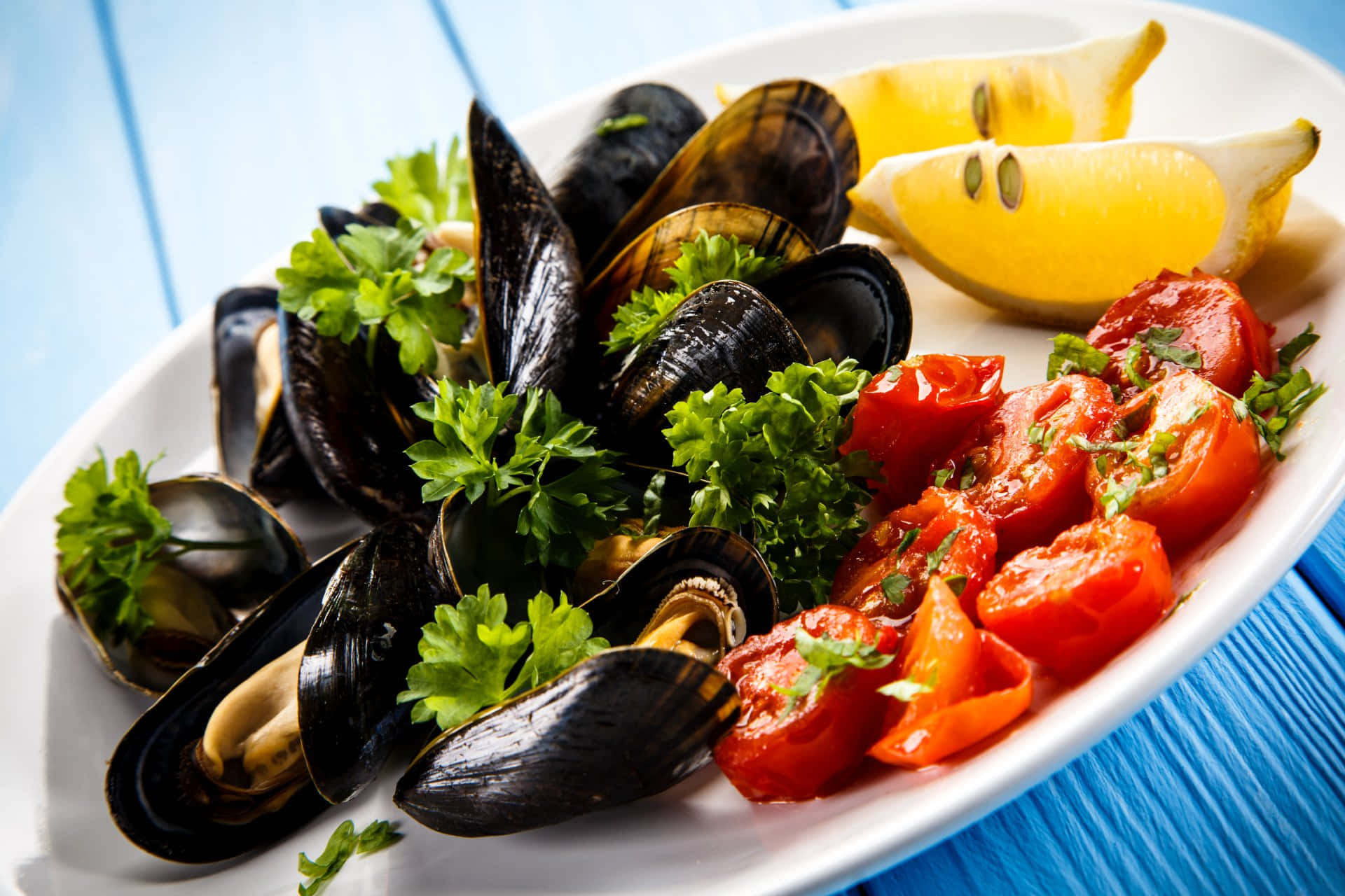 Fresh Mussels Platewith Lemonand Tomatoes Wallpaper