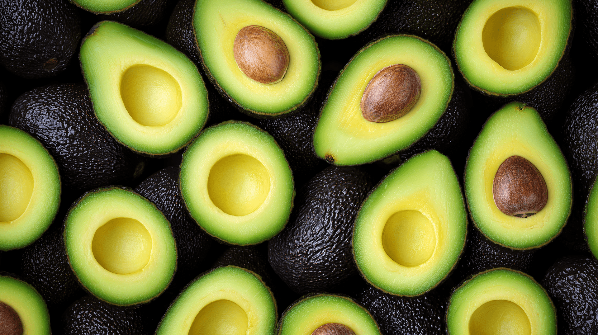 Fresh Sliced Avocados Background Wallpaper