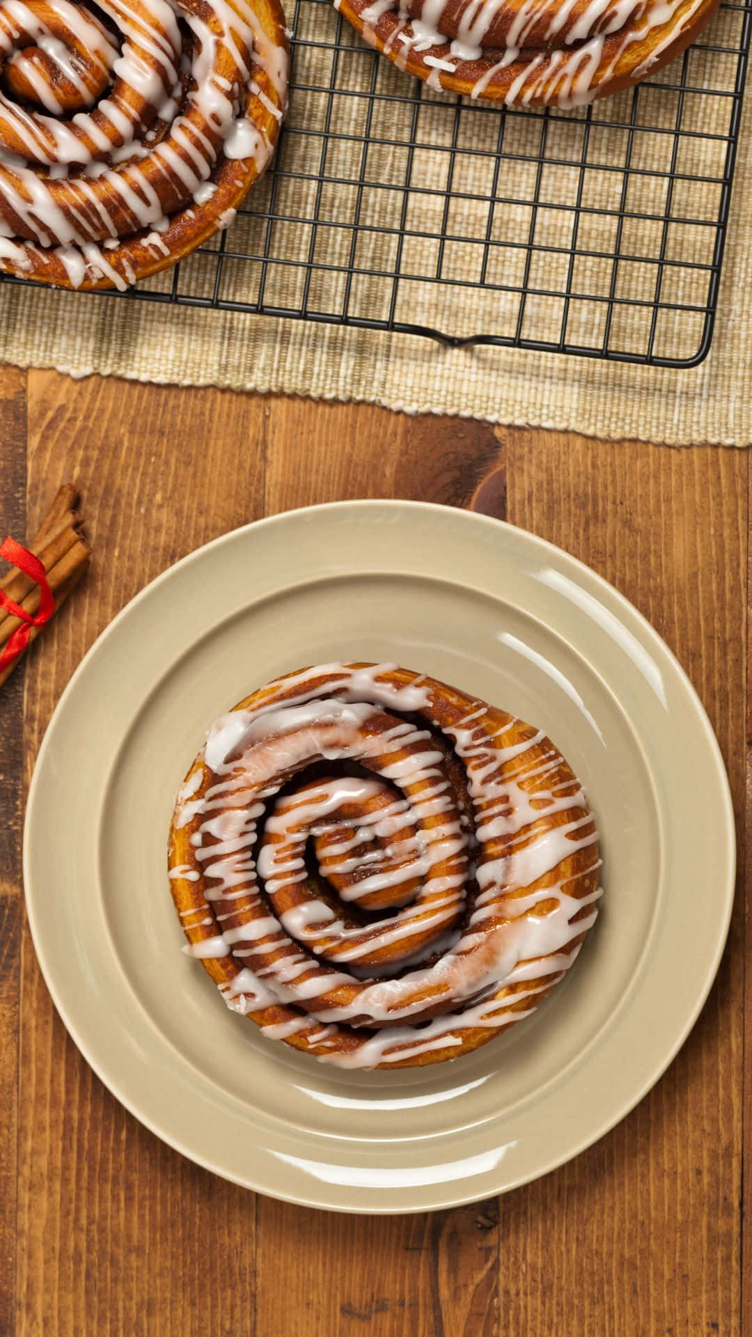 Freshly Baked Cinnamon Roll With Icing Wallpaper